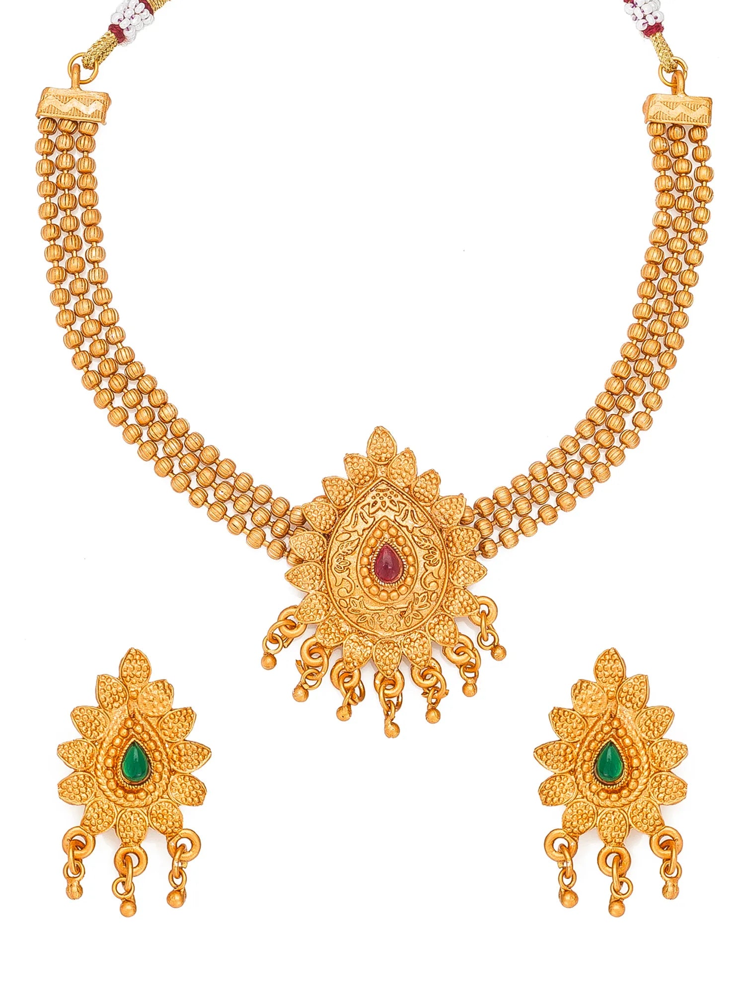 Gold-plated traditional Indian jewelry set featuring a necklace and matching earrings. The necklace has a wide double-strand beaded collar with a central sunburst pendant decorated with a small red teardrop stone.