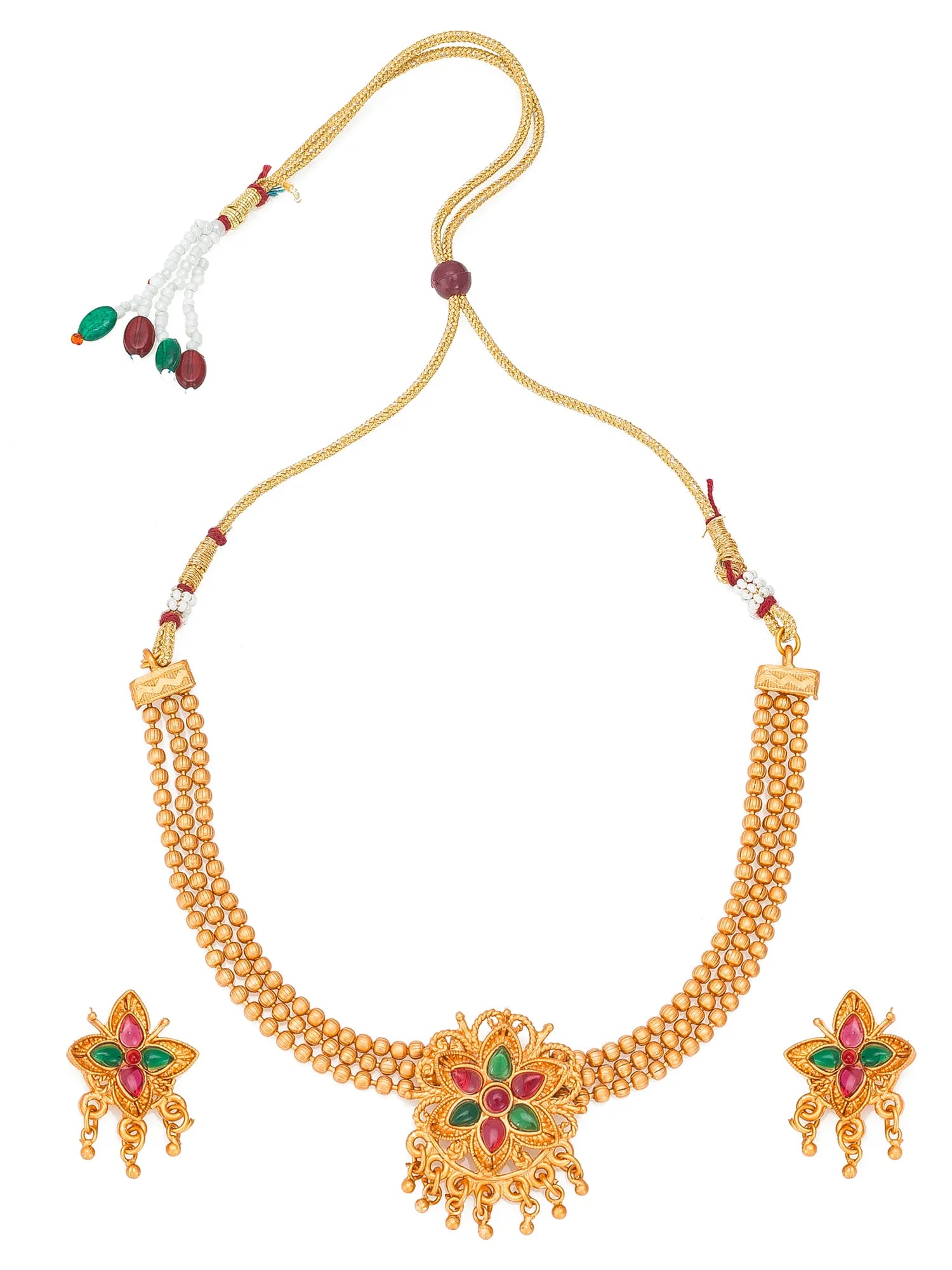 Gold-toned traditional necklace set with a beaded chain, ornate central pendant, and matching earrings with red and green stone accents, shown on a plain white background.