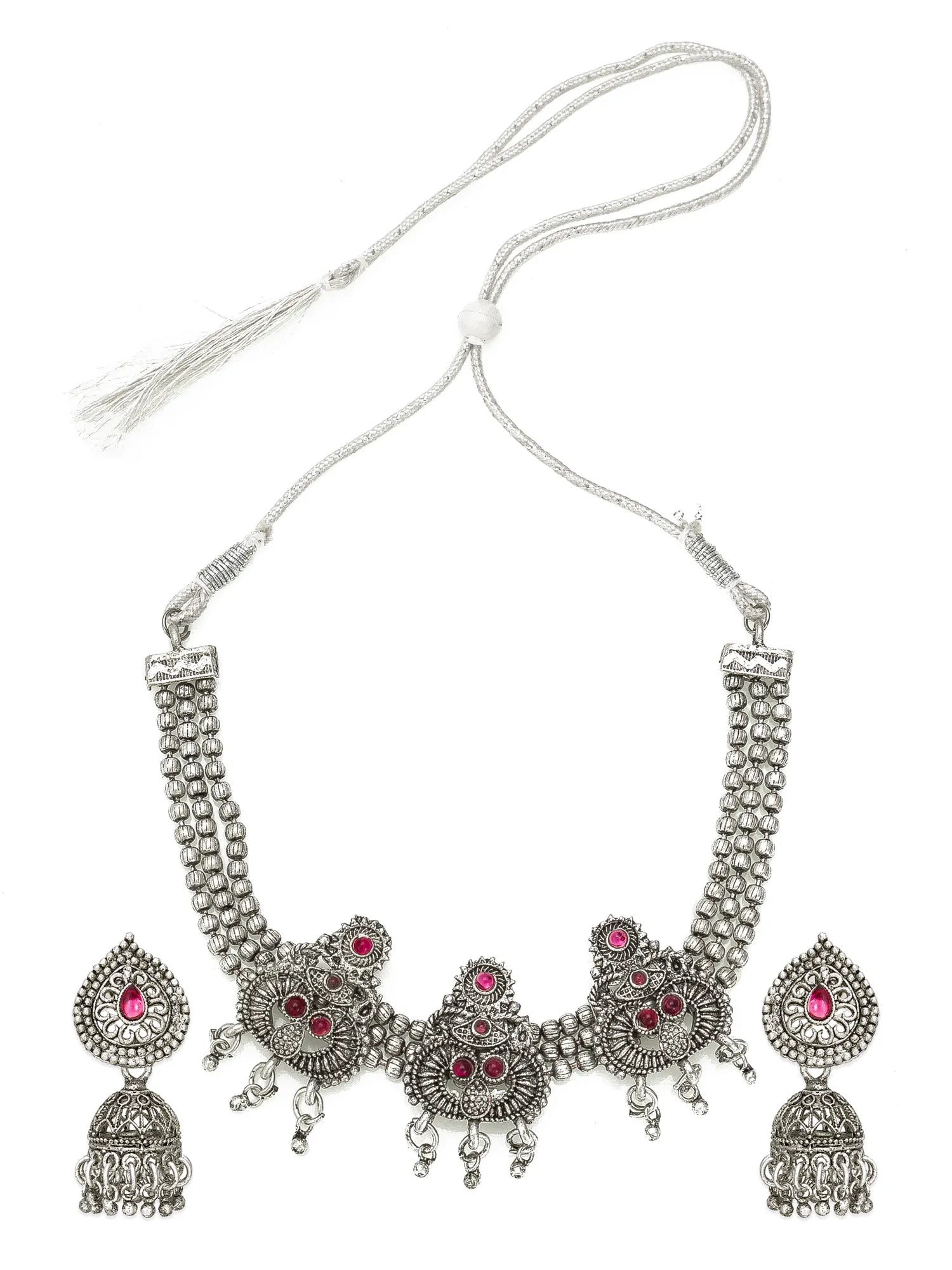 Silver-toned traditional necklace and matching earrings with red gemstone accents, displayed on a plain white background.