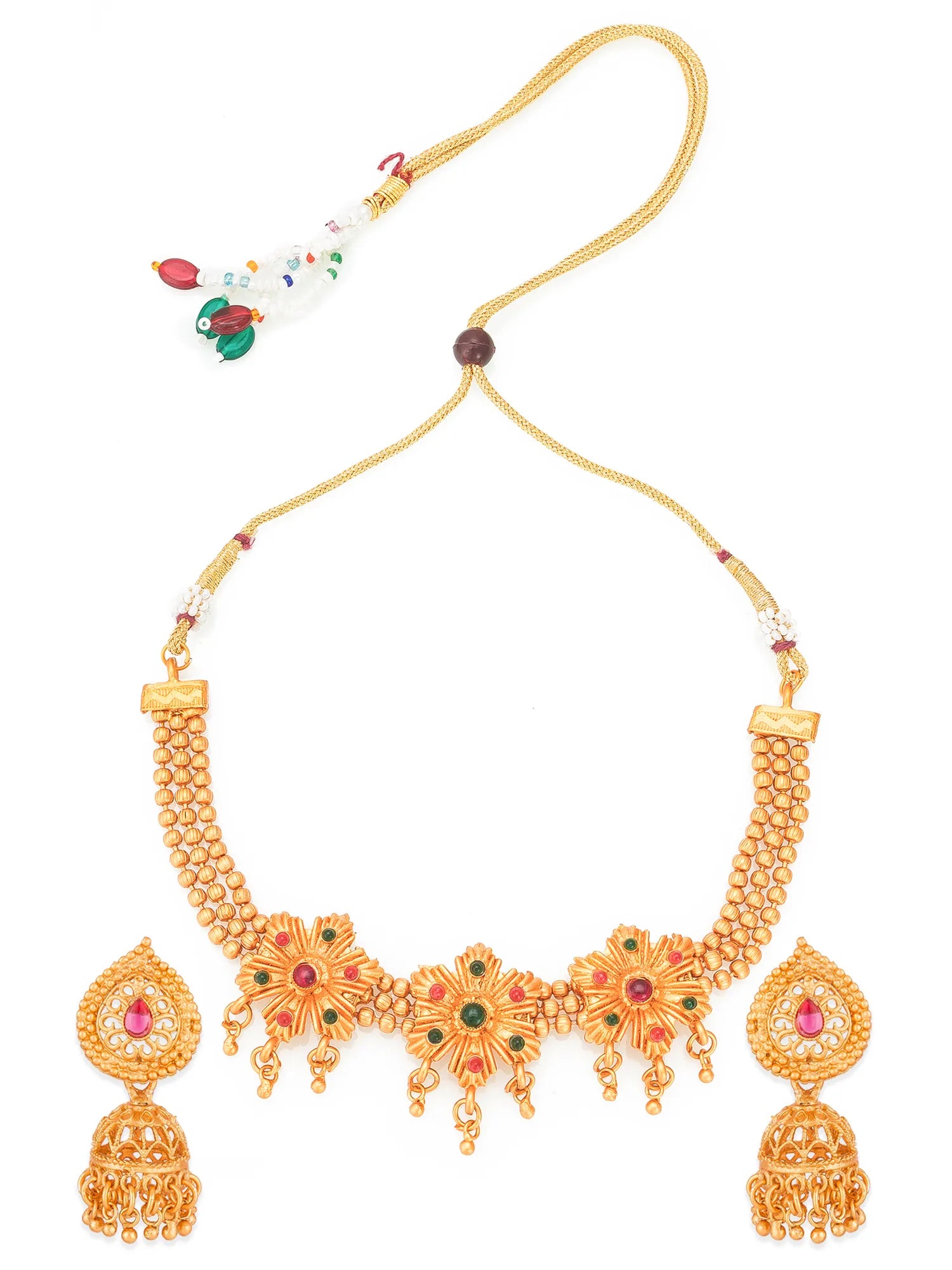 Gold-toned traditional Indian jewelry set featuring a necklace with a decorative floral choker, matching dangling earrings, and a separate tassel charm on a white background.