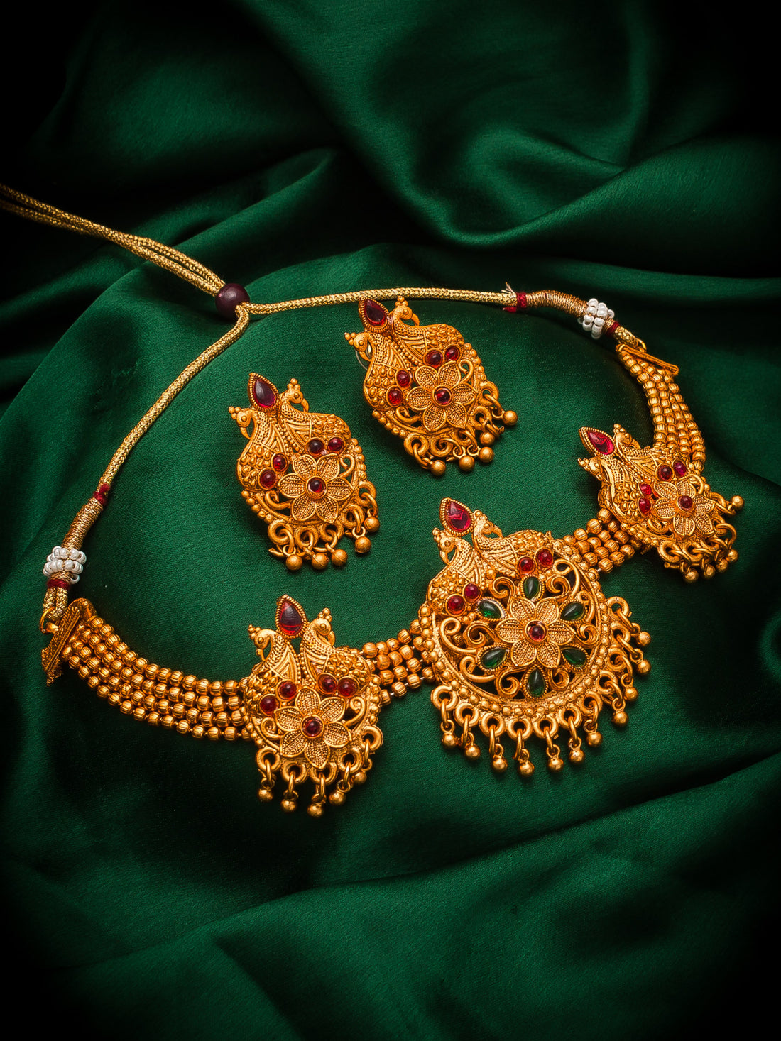 Aadita Gold-Tone Floral Choker Necklace Set with Emerald Stones and Chandelier Earrings