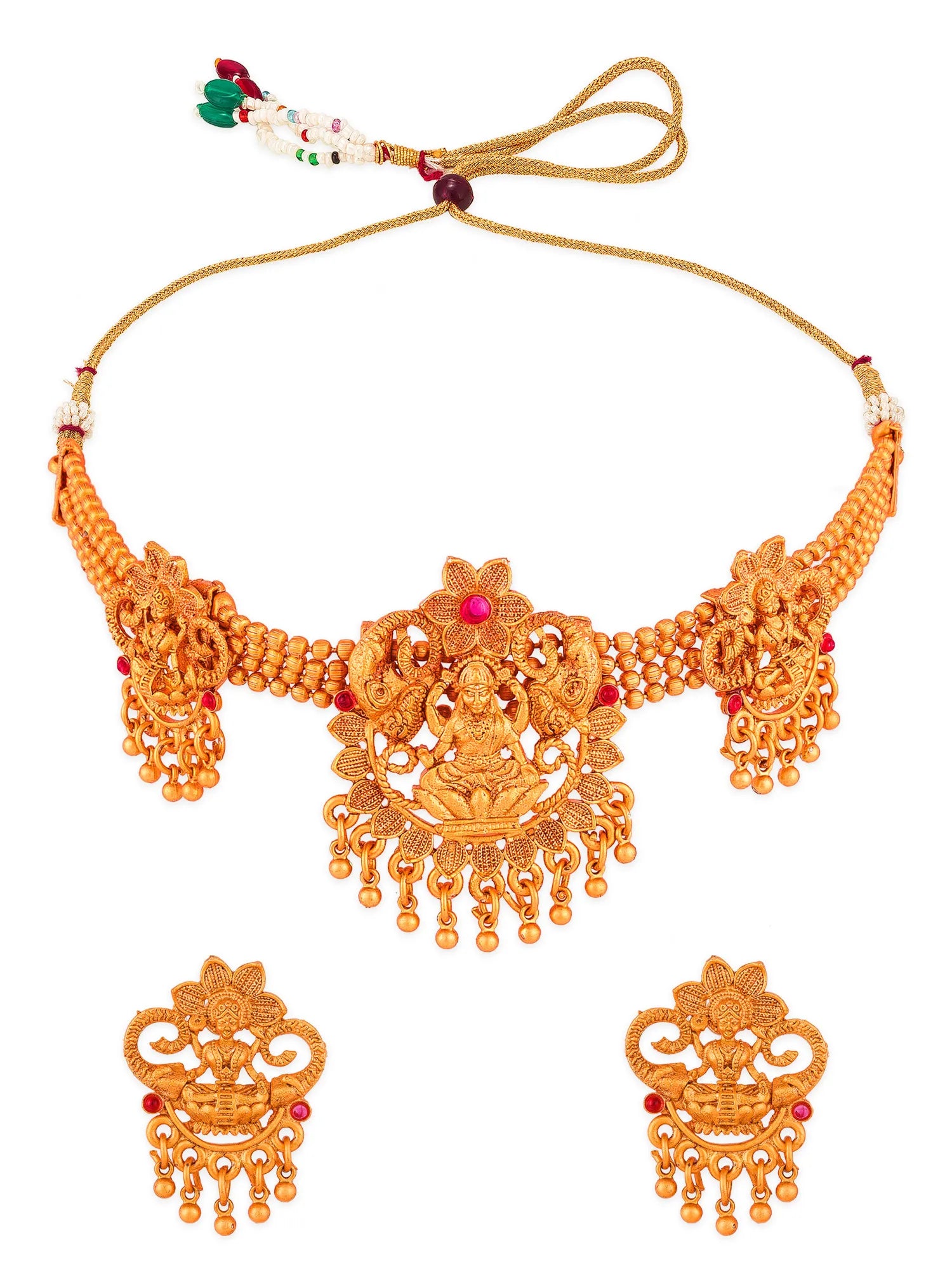 Gold-toned traditional Indian jewelry set featuring a choker necklace with a central deity motif, matching drop earrings, and a beaded tie string with red and green decorative beads, shown on a plain white background.