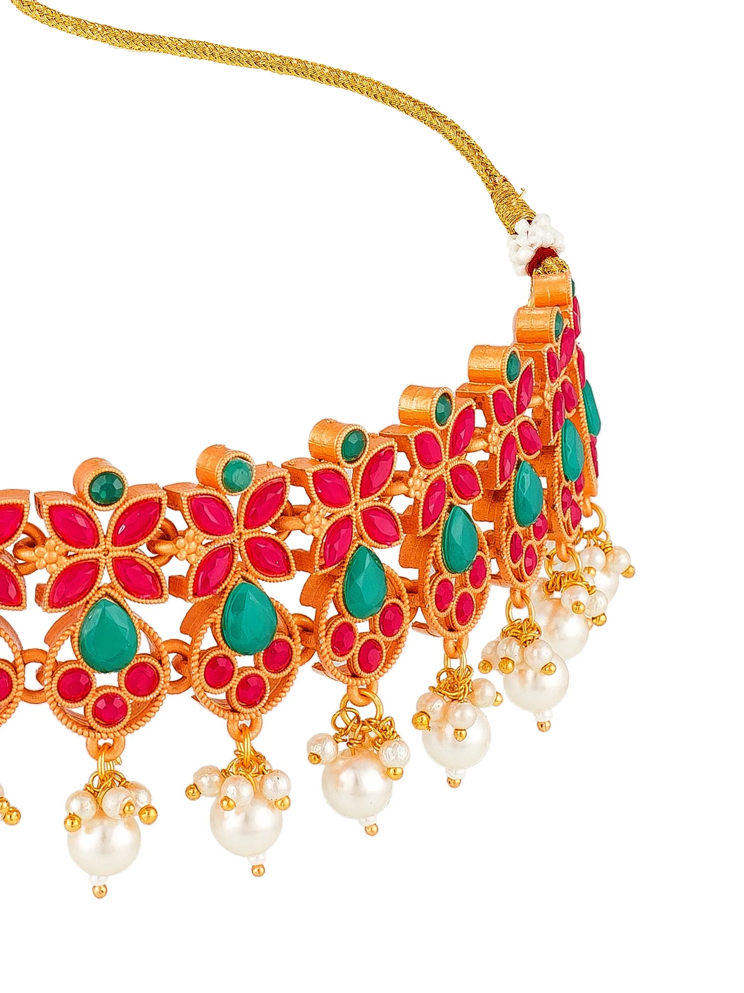 Gold-plated traditional Indian choker necklace with red and green stone floral motifs and dangling white pearl beads, shown on a white background.
