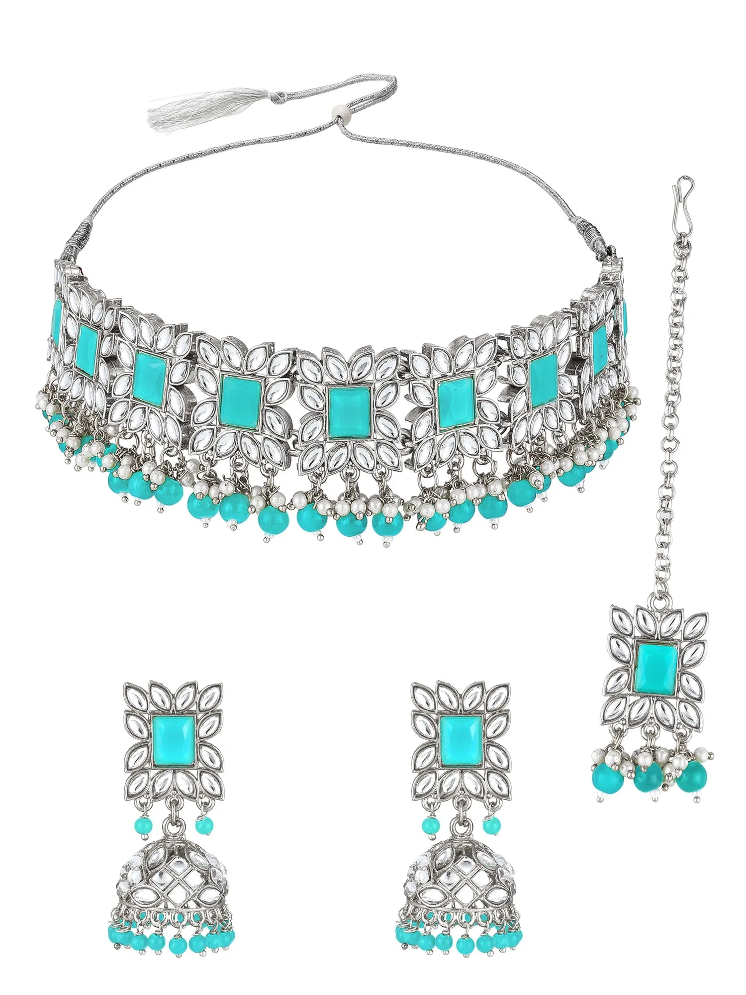 Silver-toned traditional Indian jewelry set featuring a choker necklace, matching dangling earrings, and a maang tikka, decorated with turquoise-colored square and round stones and silver filigree details, shown on a plain white background.
