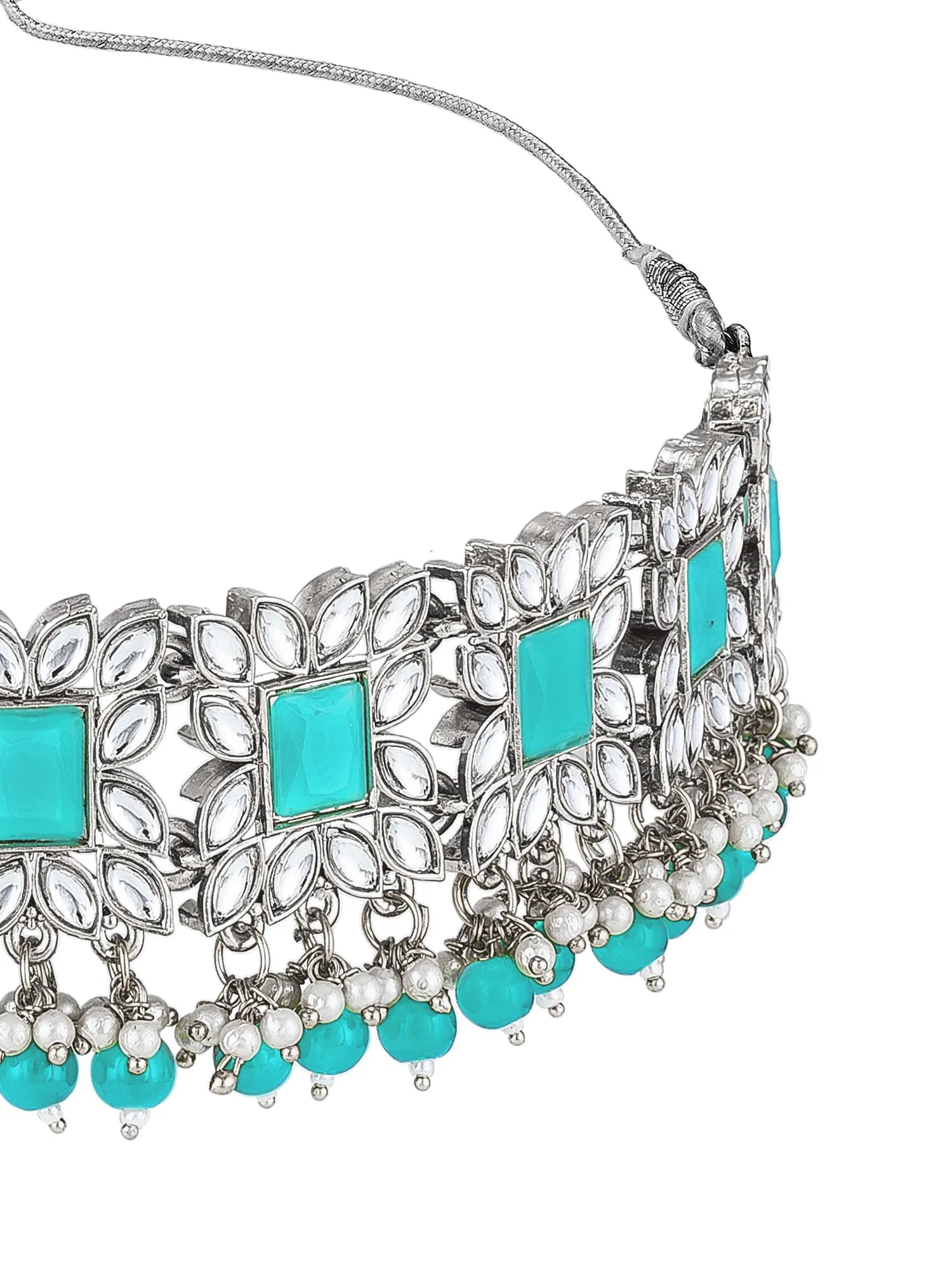 Silver-toned choker necklace with turquoise blue square and round stones, clear crystal floral motifs, and dangling bead drops on a white background.