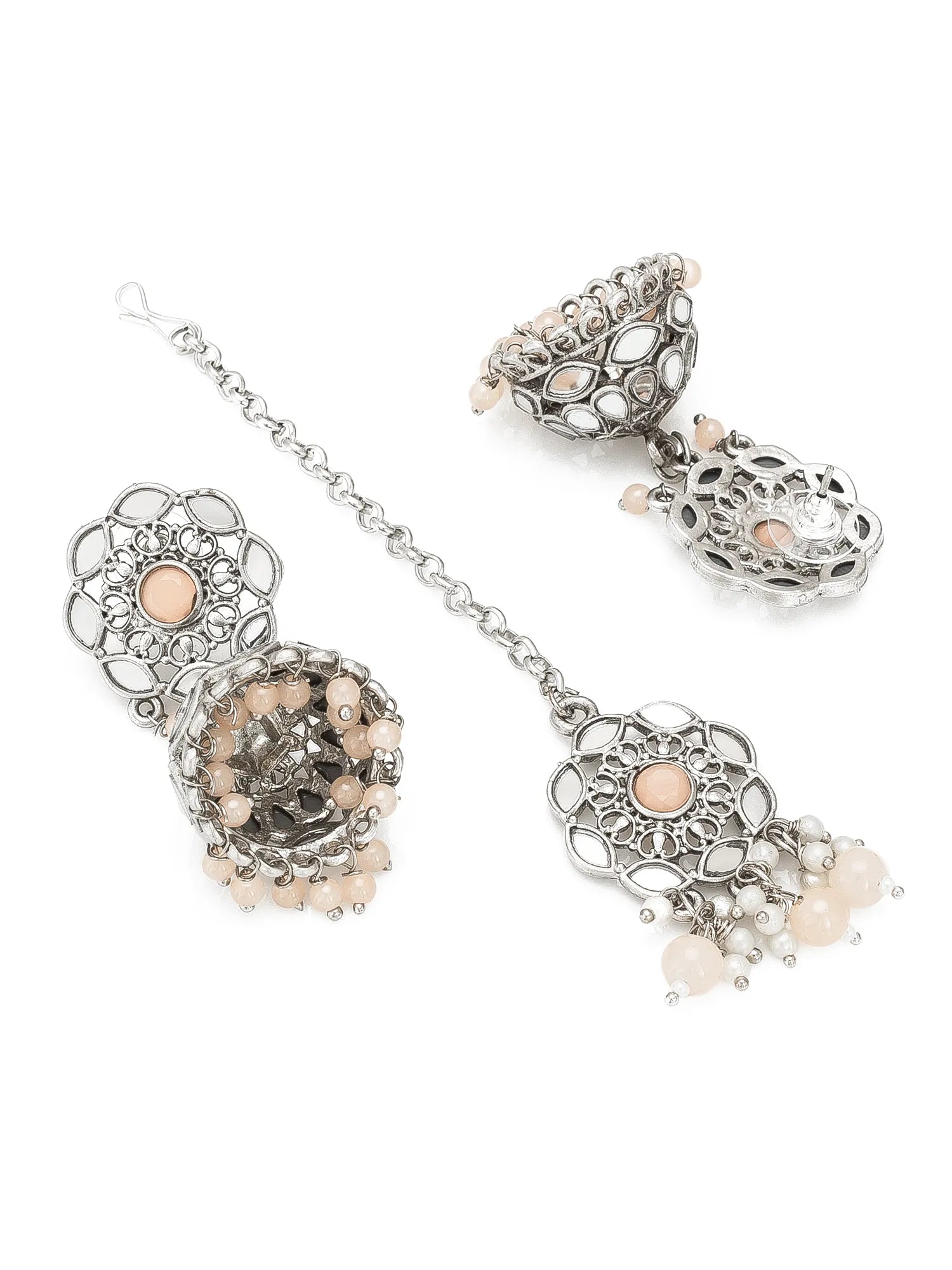 Silver-toned traditional Indian jhumka earrings with peach-colored stones and bead details, displayed on a clean white background.