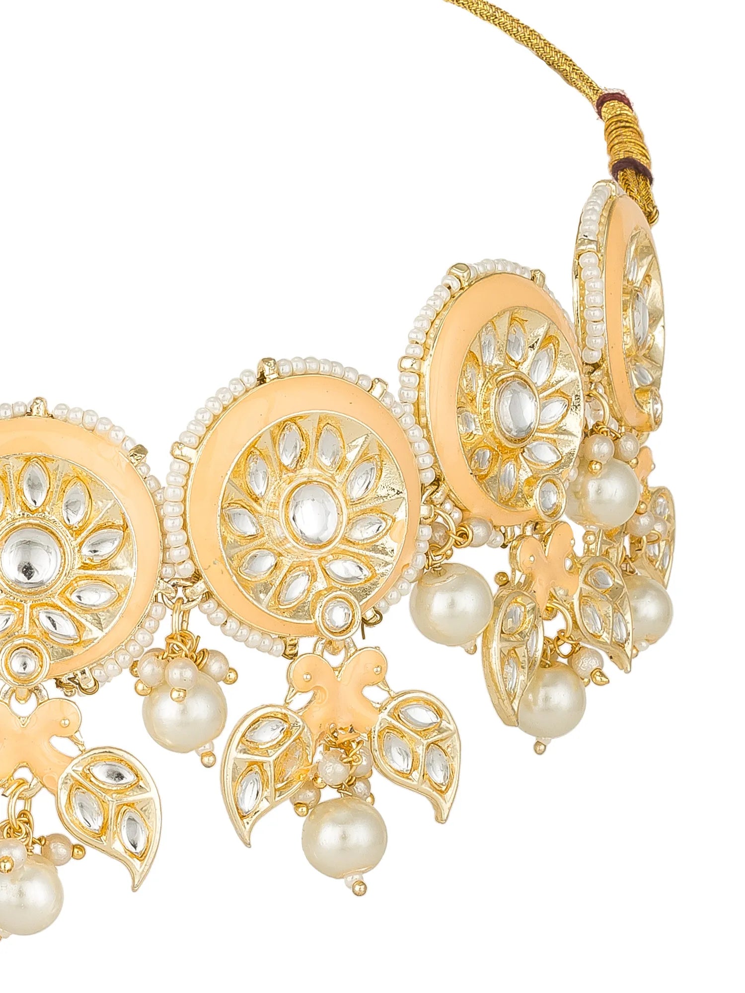 Gold-plated Kundan choker necklace with cream-colored enamel inlays, white faux pearls, and clear rhinestone embellishments, shown on a white background.