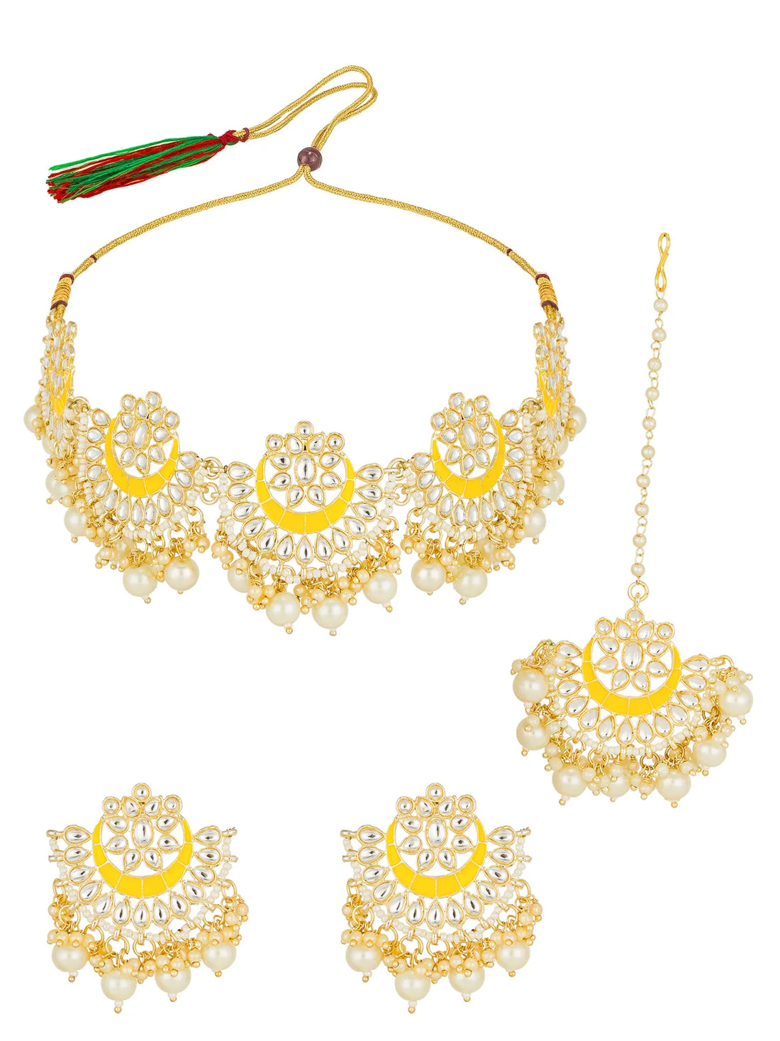 Gold-plated traditional Indian jewelry set featuring a necklace, earrings, and a maang tikka, embellished with white faux pearls and bright yellow crescent-shaped inlays, displayed on a dark navy blue fabric background.