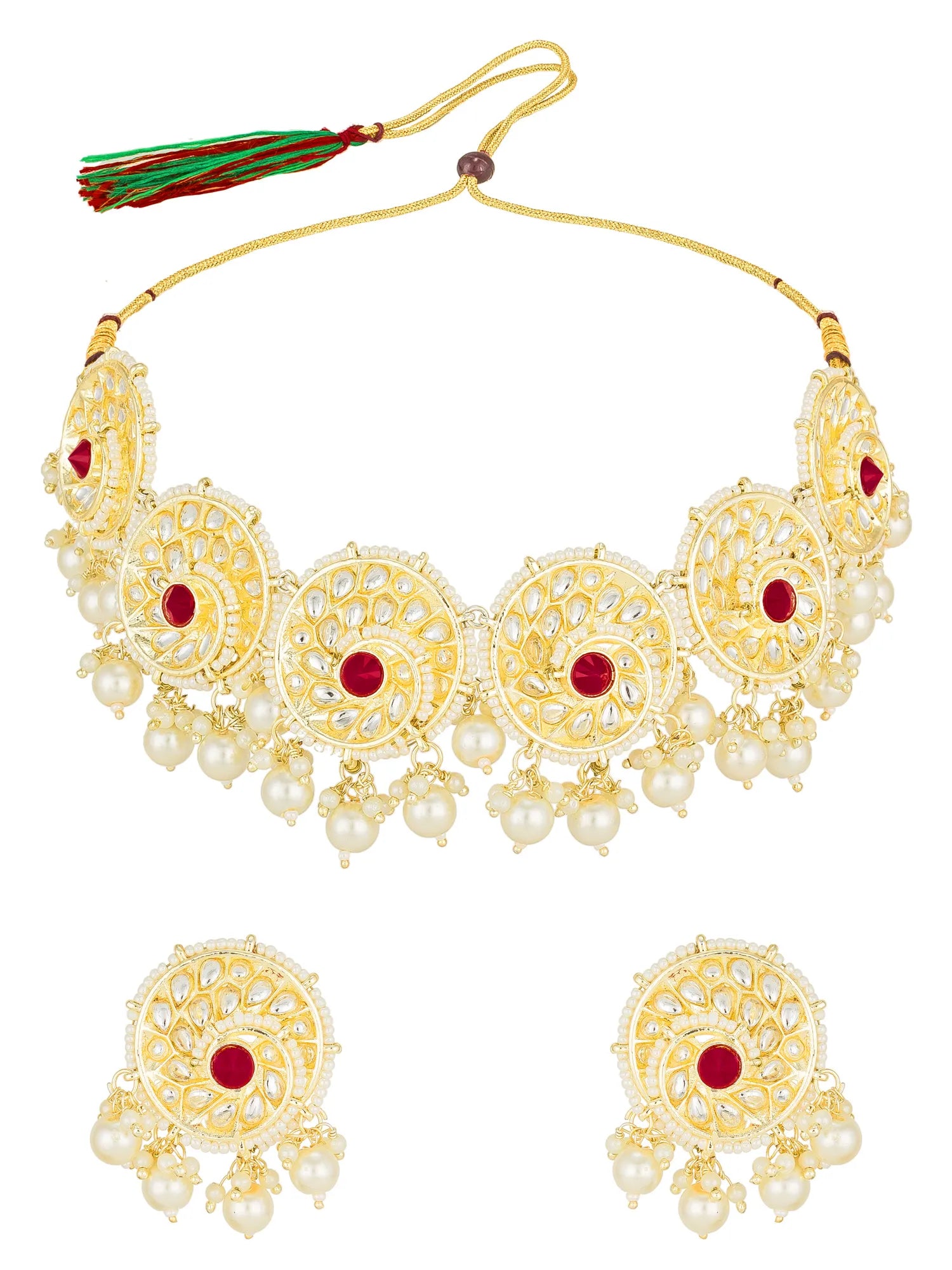 Gold-toned traditional necklace and matching earrings with intricate filigree detailing, white pearl-like beads, and red gemstone accents on a plain white background.