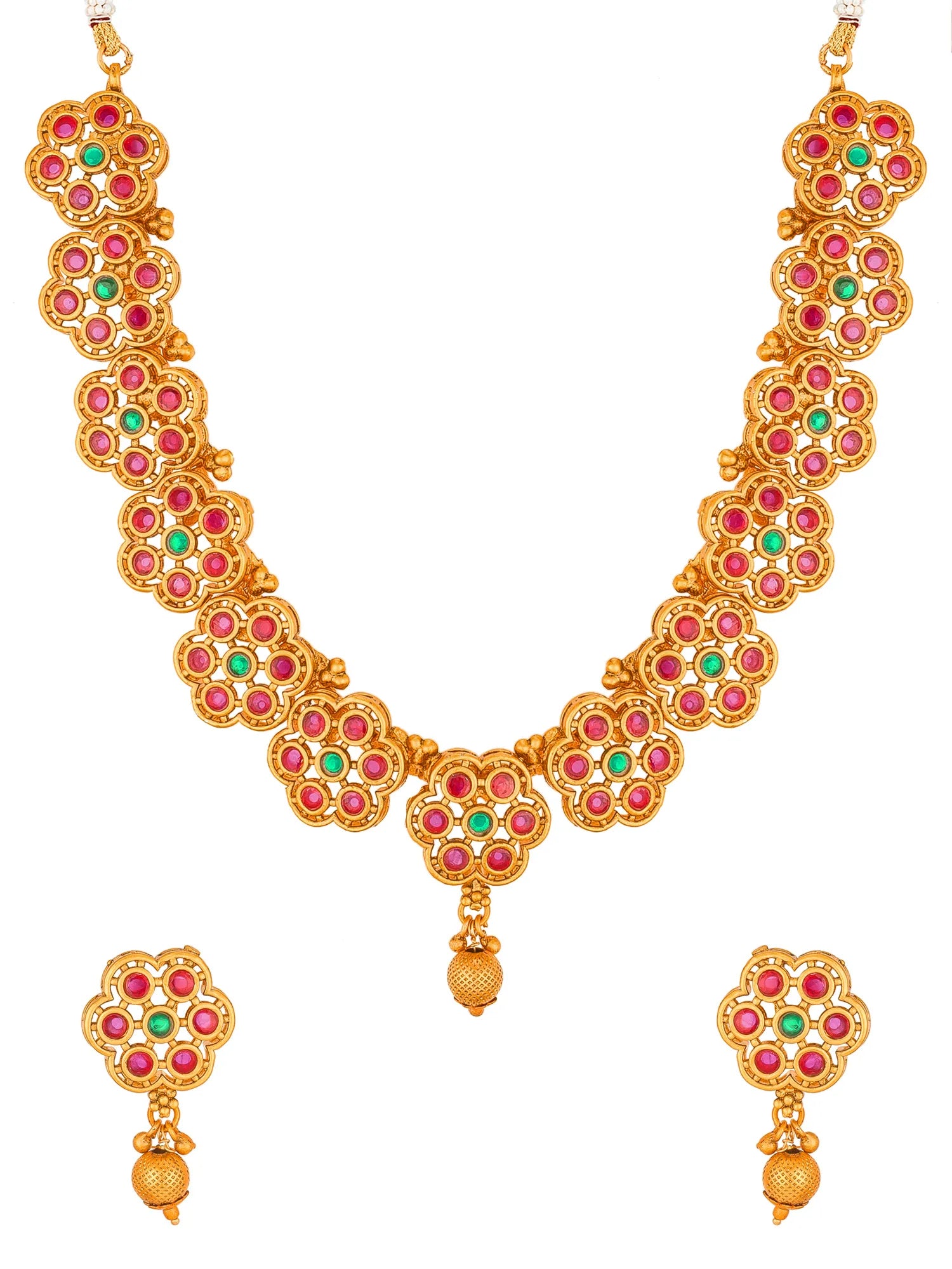 Gold-plated traditional Indian jewelry set featuring a necklace and matching earrings, embellished with red and green stones in a floral pattern.