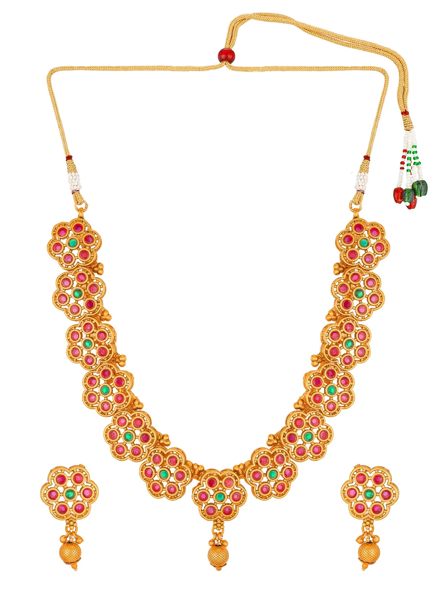 Gold-toned traditional necklace and matching earrings set with red and green stone floral motifs, displayed on a plain white background.