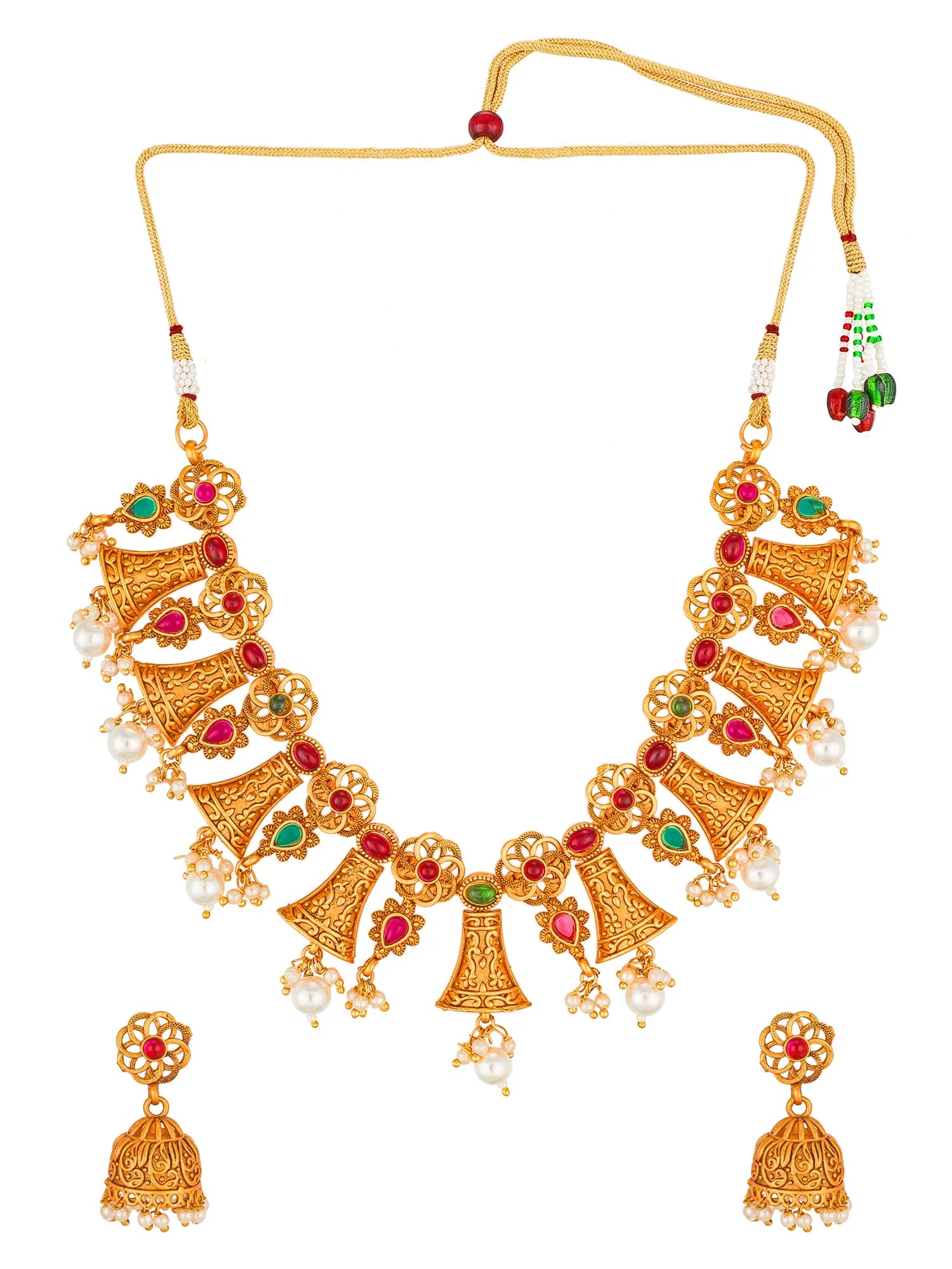 Gold-toned traditional necklace and matching jhumka earrings with red and green stone accents and white pearl-like beads, shown on a plain white background.