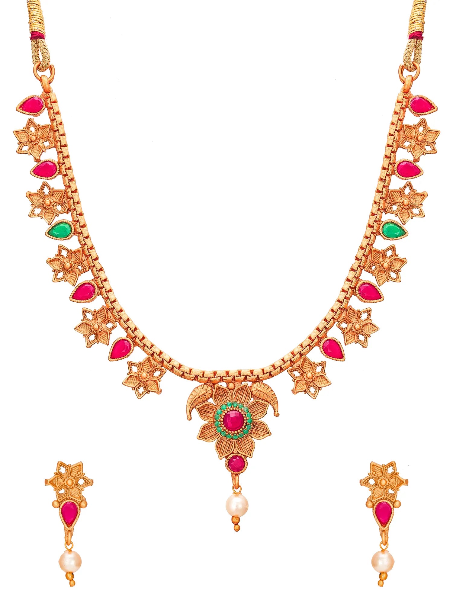 Gold-toned traditional necklace and matching drop earrings set with red and green stones and pearl-like drops, shown on a plain white background.