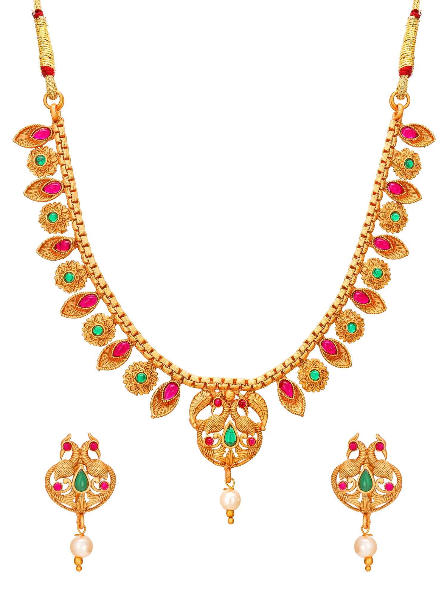 Gold-plated Indian jewelry set featuring a necklace and matching earrings decorated with red and green stones and white pearl drops, shown on a plain white background.