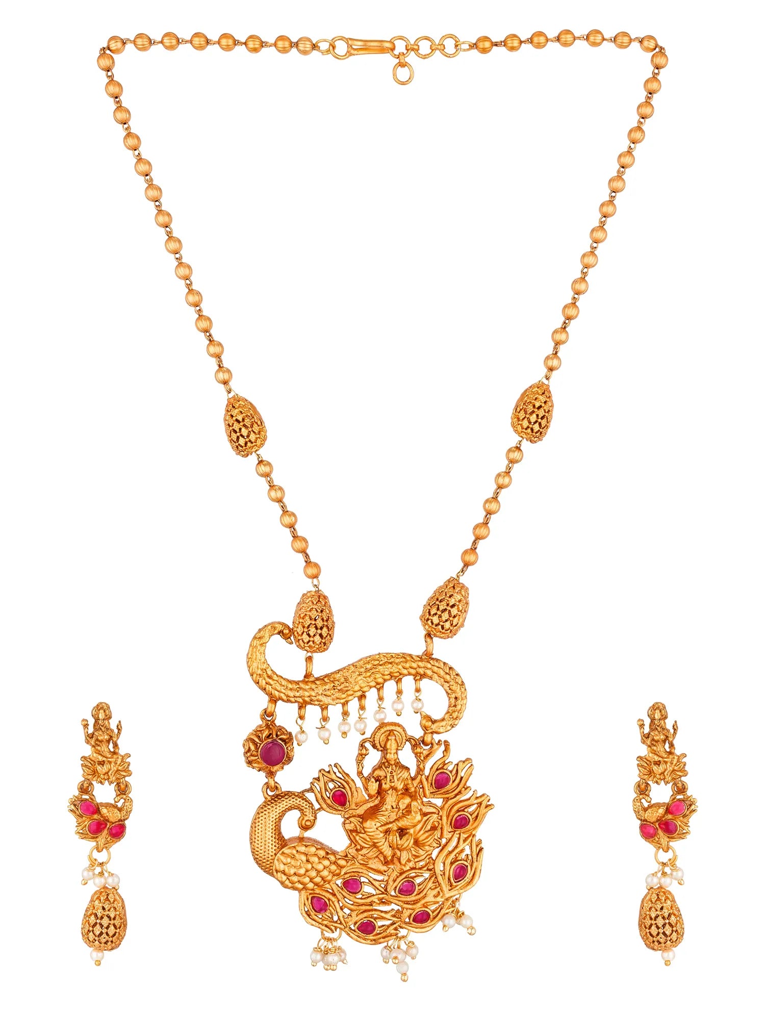 Gold-plated necklace and matching drop earrings featuring a detailed peacock pendant with red gemstone accents and small pearl-like dangling beads, shown on a plain white background.