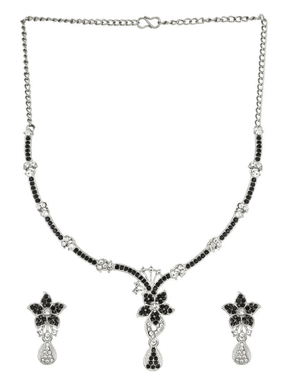 Necklace and earrings set with black and silver design on a white background