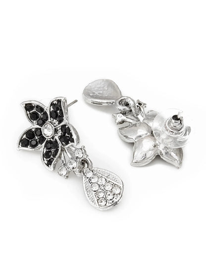 Pair of silver earrings with floral and heart designs on a white background