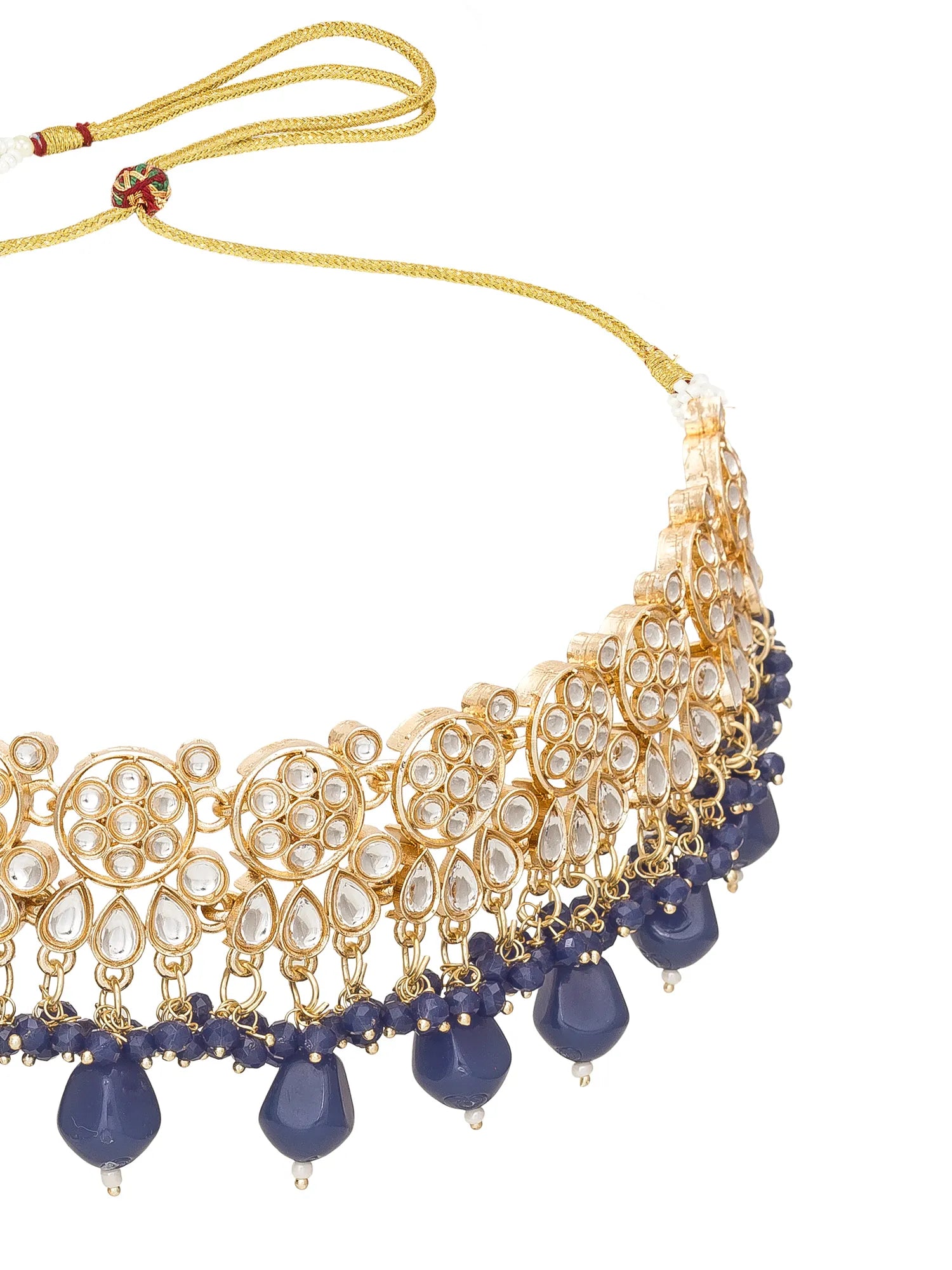 Ornate necklace with gold and blue beads on a white background