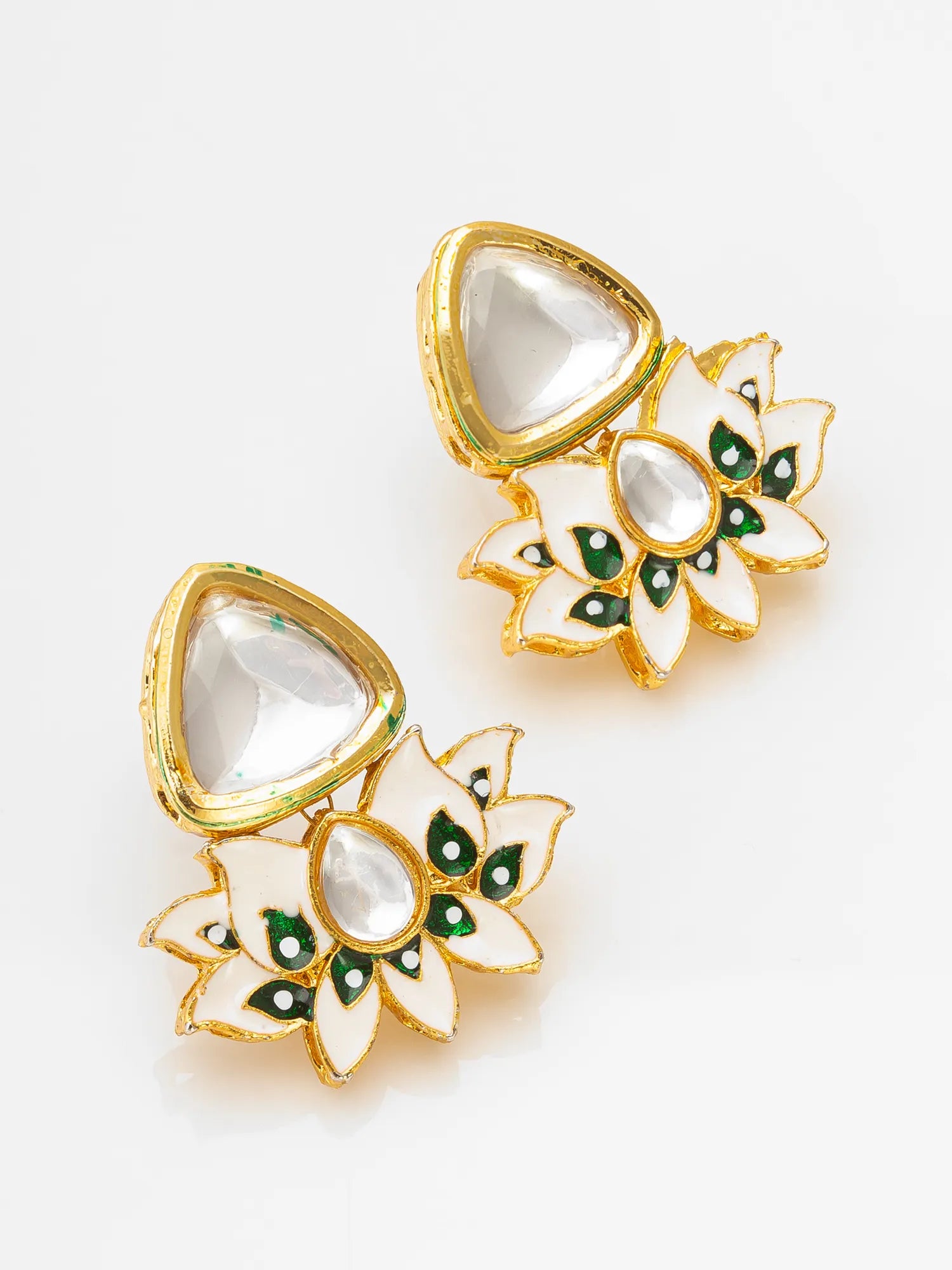 Pair of gold and green earrings on a white background