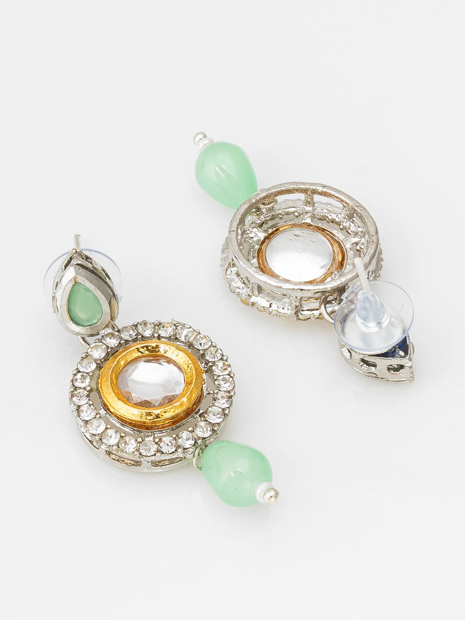 Pair of earrings with gold, silver, and green beads on a white background