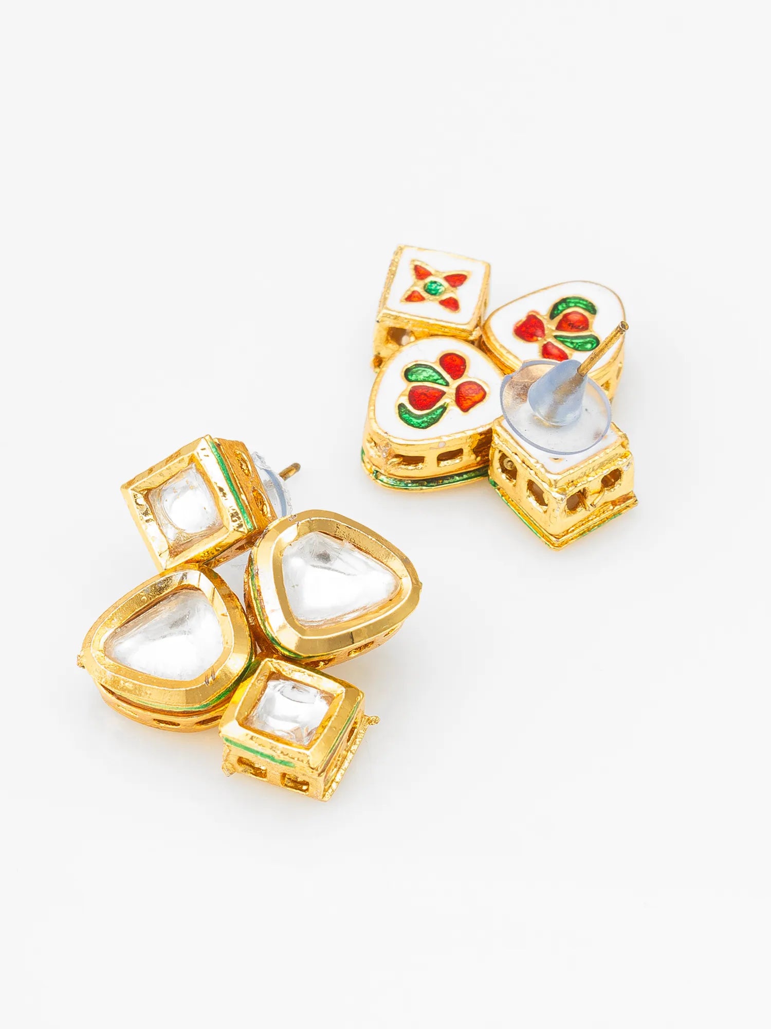 A pair of gold-plated Indian Kundan earrings featuring white stone inlays and colorful red, green, and orange floral enameled details, displayed on a clean white background.