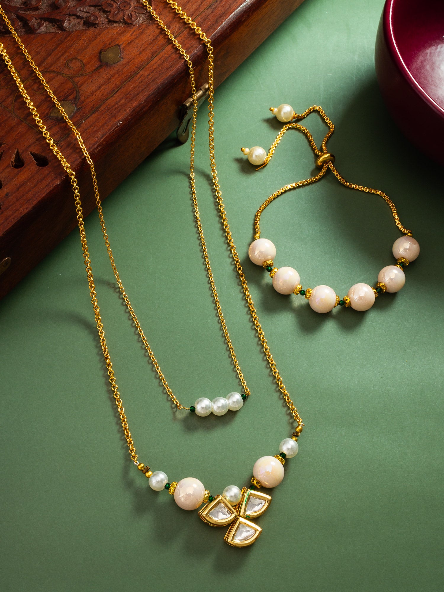 Elegant Gold-Plated Layered Pearl Necklace with Kundan Clover Pendant and Matching Bracelet Set