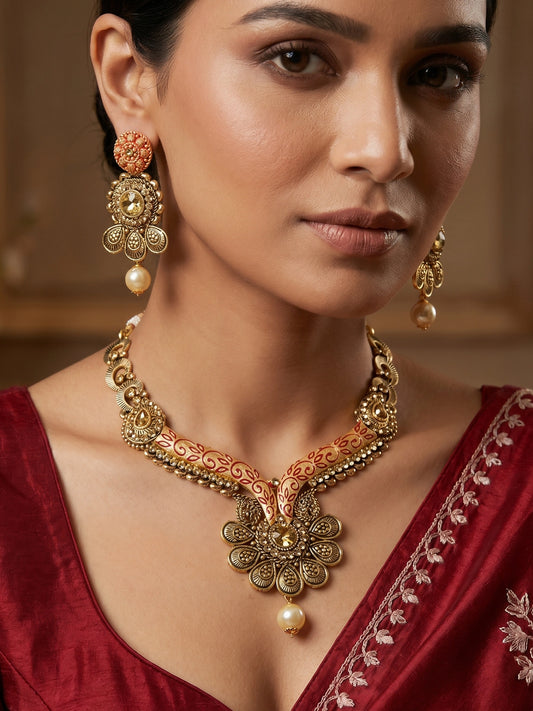 Aadita Antique Gold Floral Necklace Set with Orange Meenakari Accents, Pearl Drop and Matching Earrings