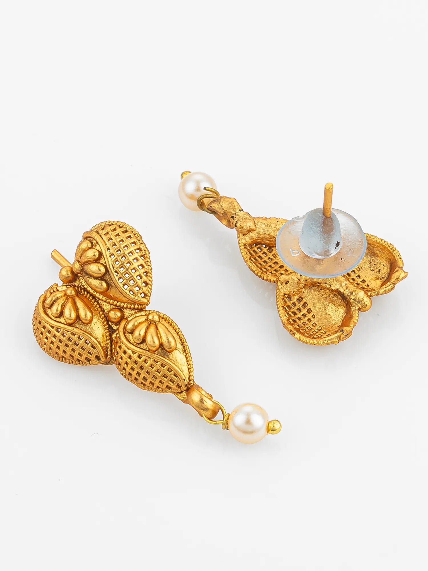 Gold earrings with pearl accents on a white background