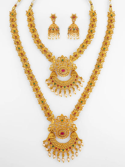 Gold necklace set with matching earrings on a white background