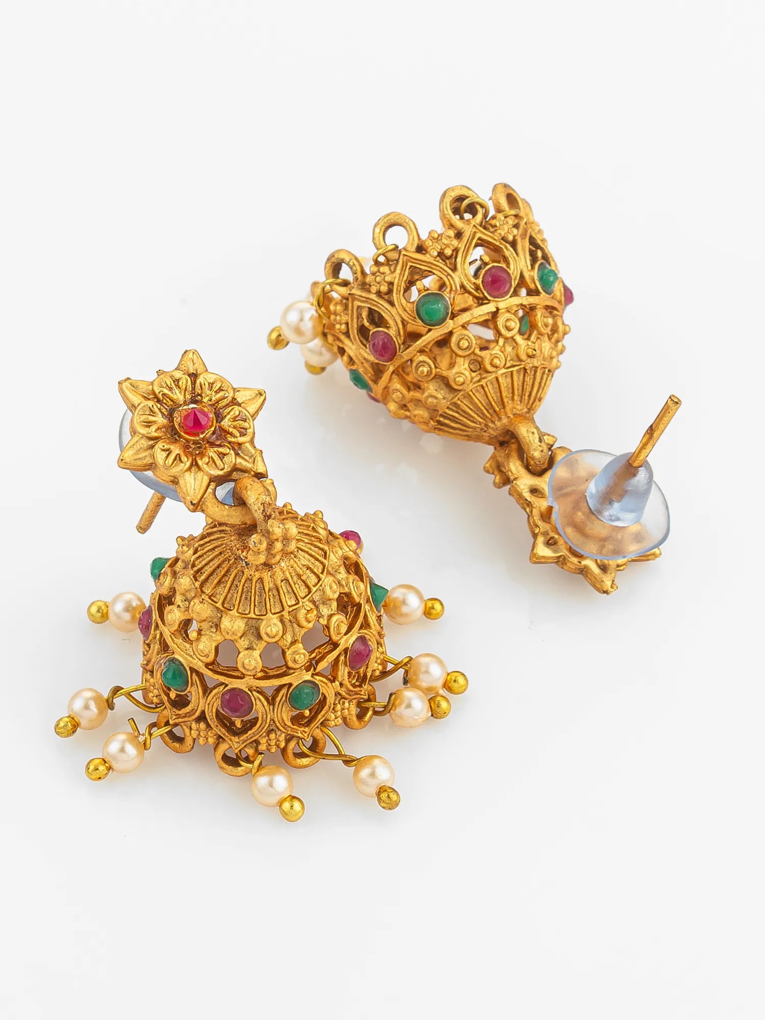 Gold earrings with gemstones on a white background