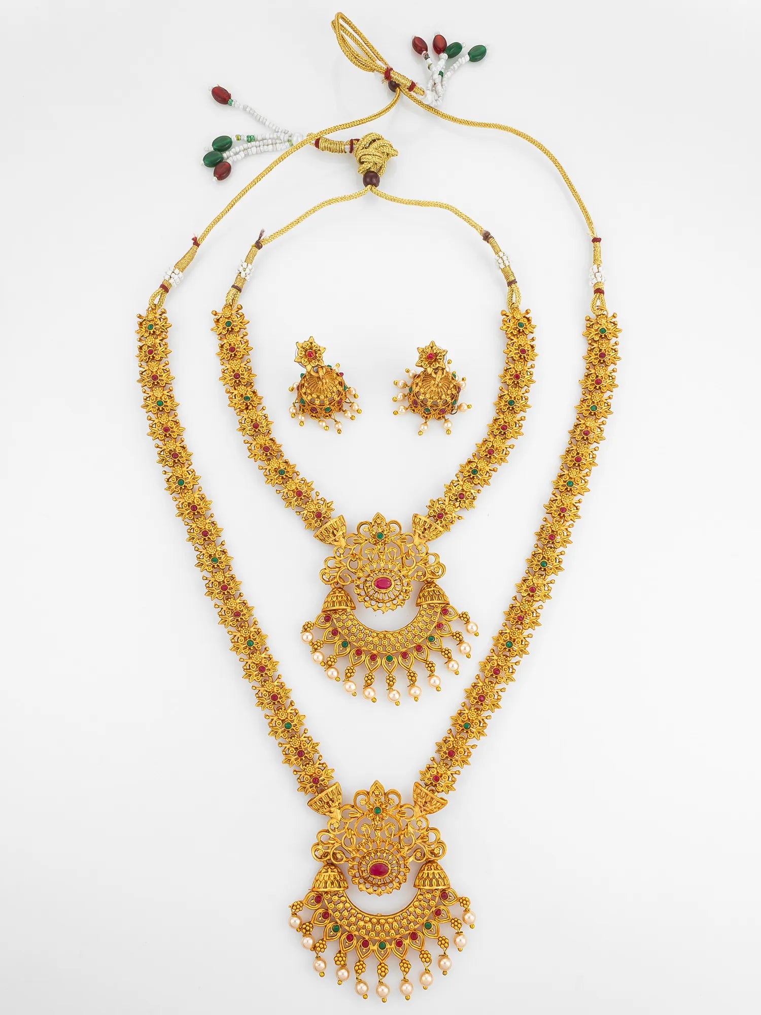 Gold necklace set with earrings on a white background