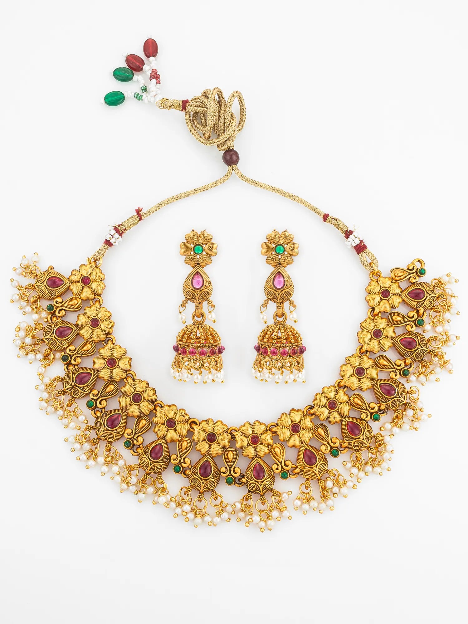 Gold necklace with matching earrings on a white background