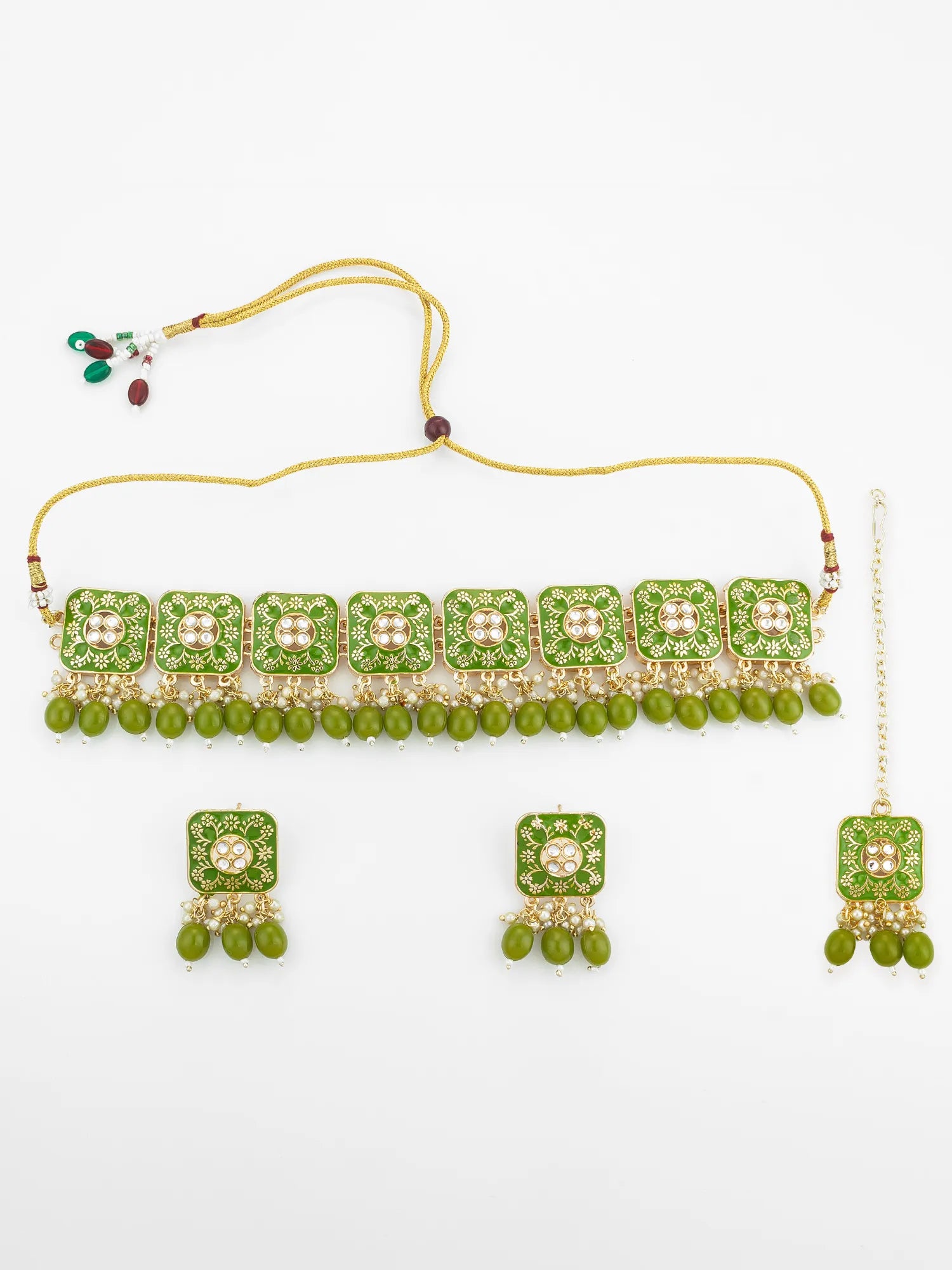Green and gold jewelry set with necklace, earrings, and bangles on a white background