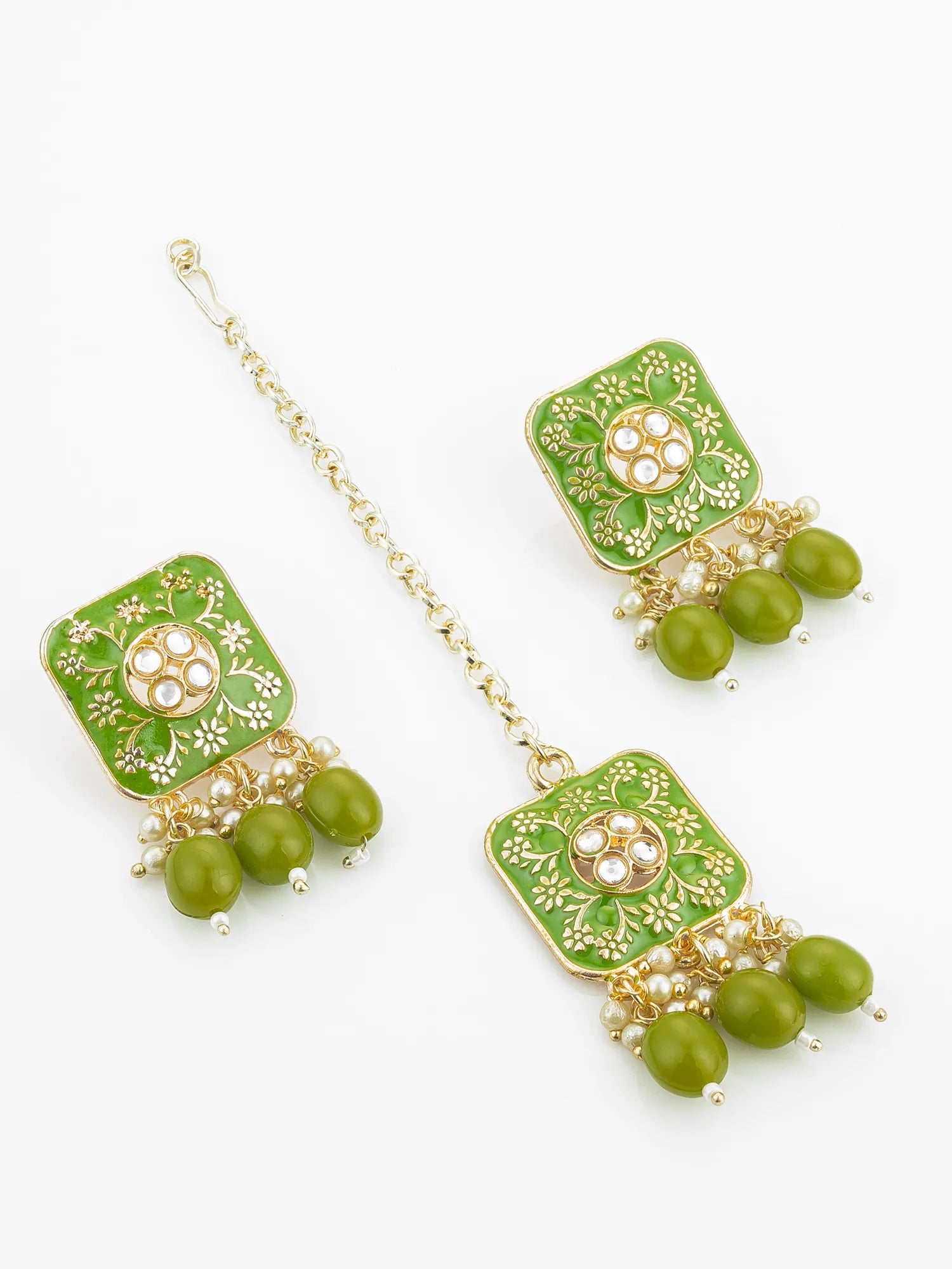 Green and gold earrings with beads on a white background