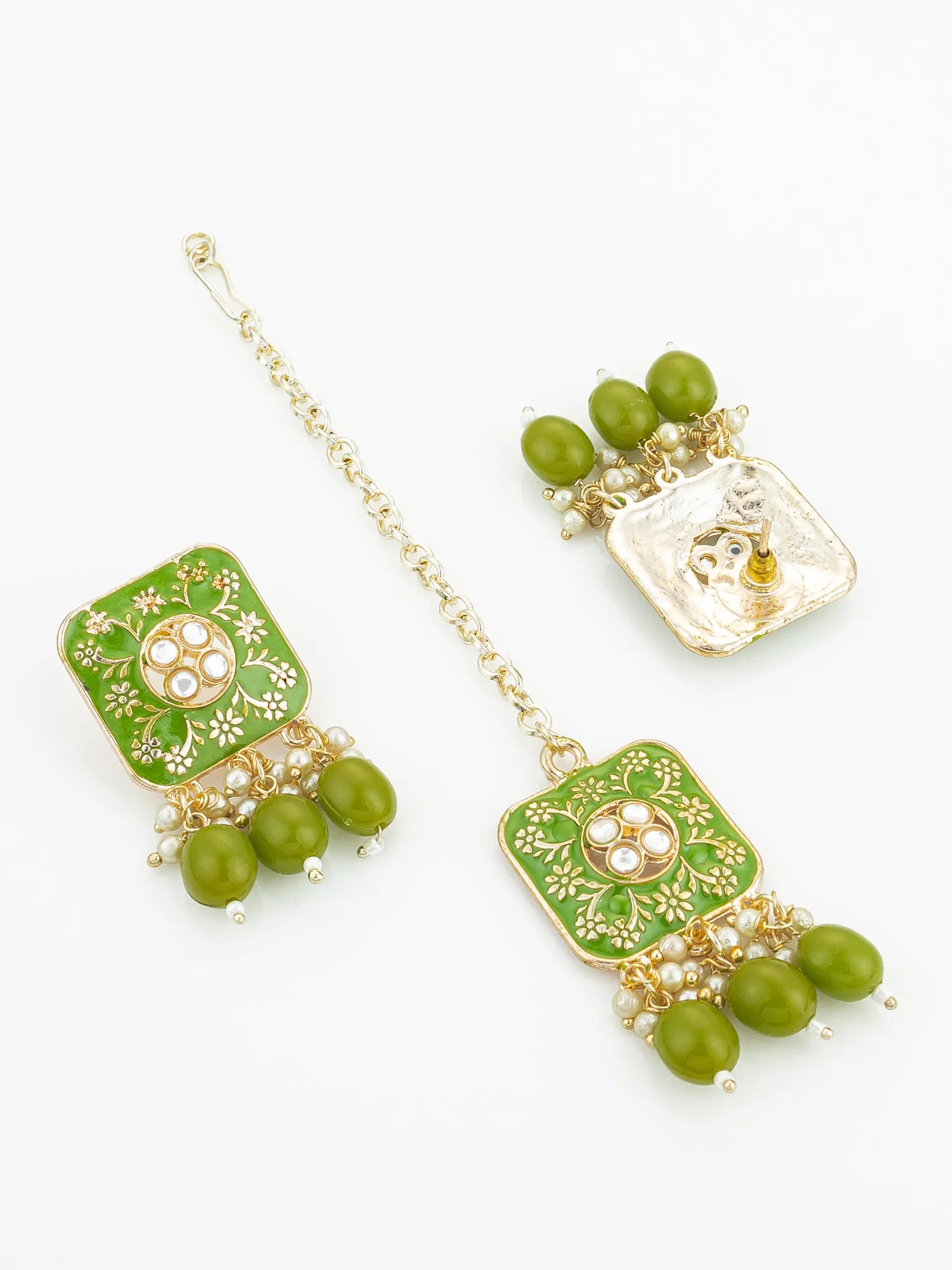 Green and gold jewelry set with beads on a white background