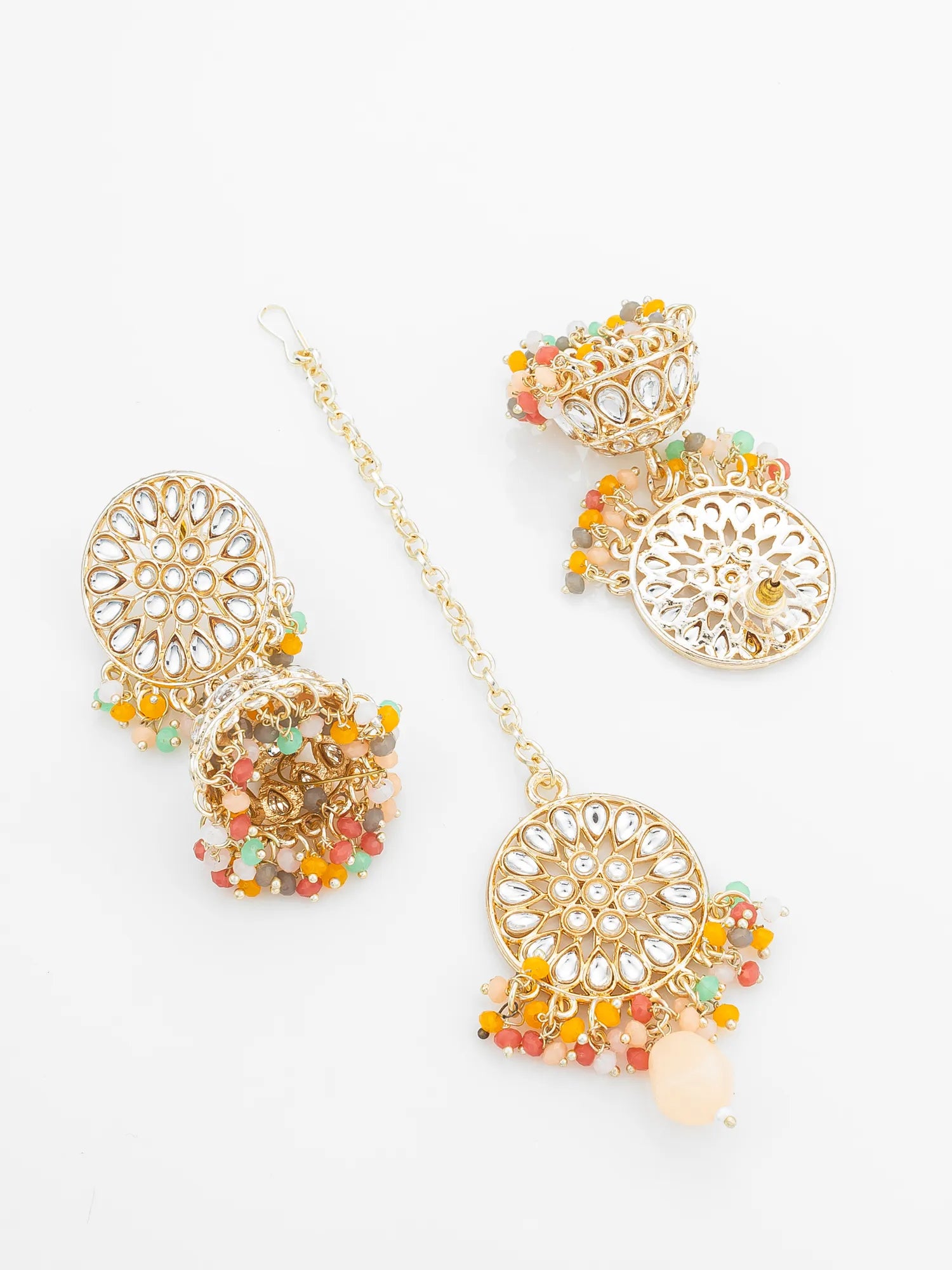 Decorative earrings with gold filigree design and colorful beads on a white background