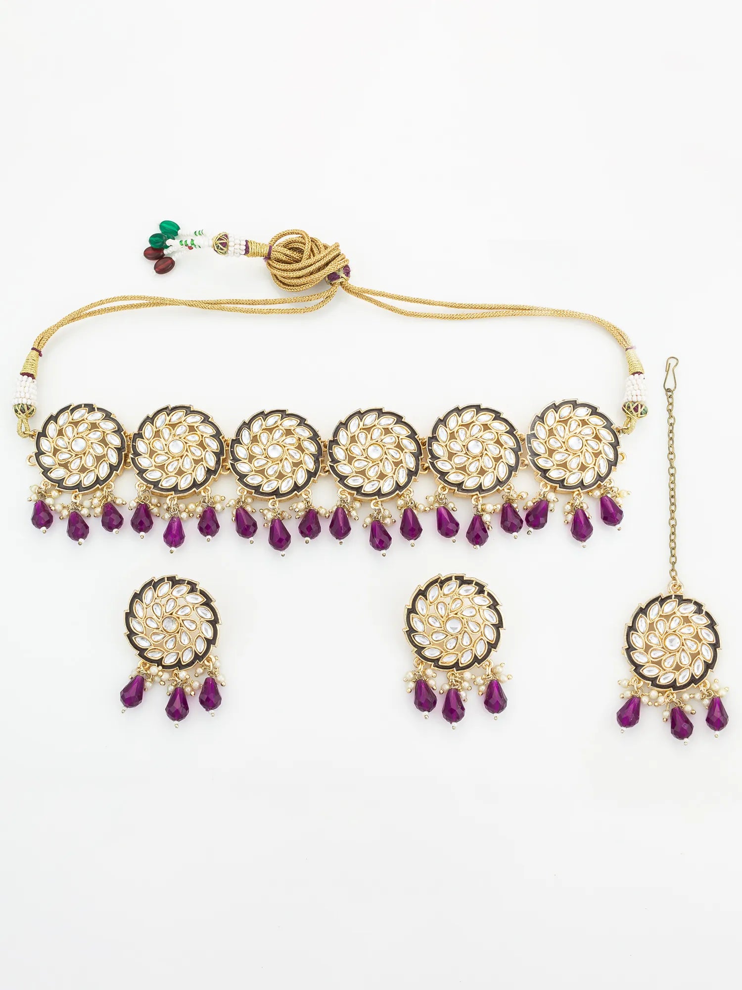 Jewelry set with necklace, earrings, and bangles on a white background