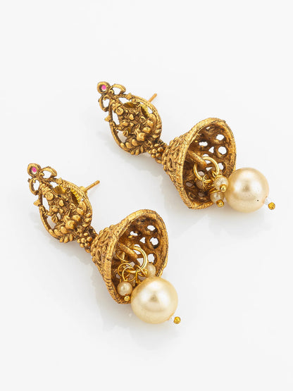Gold earrings with pearl drops on a white background