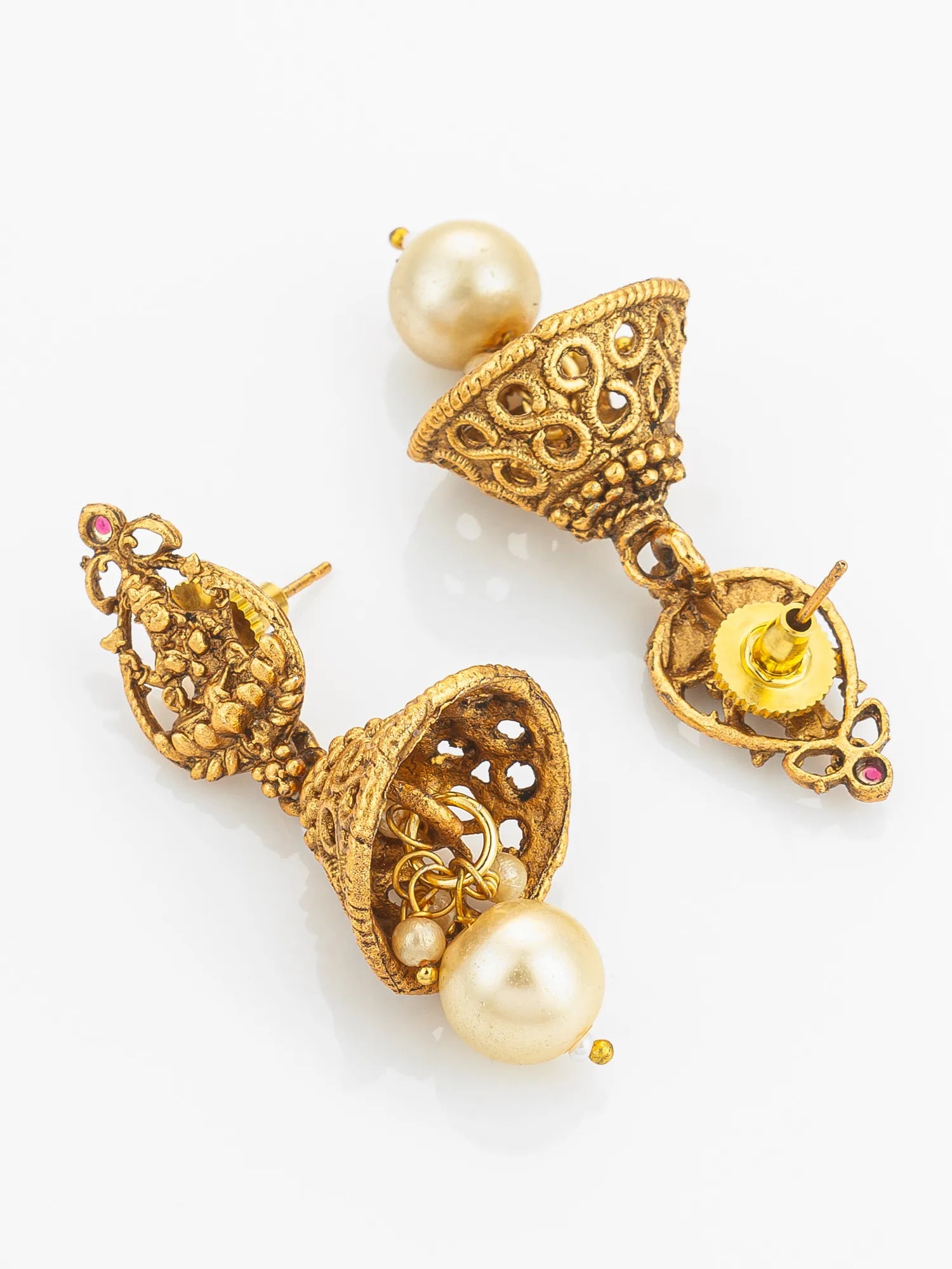 Gold earrings with pearls on a white background