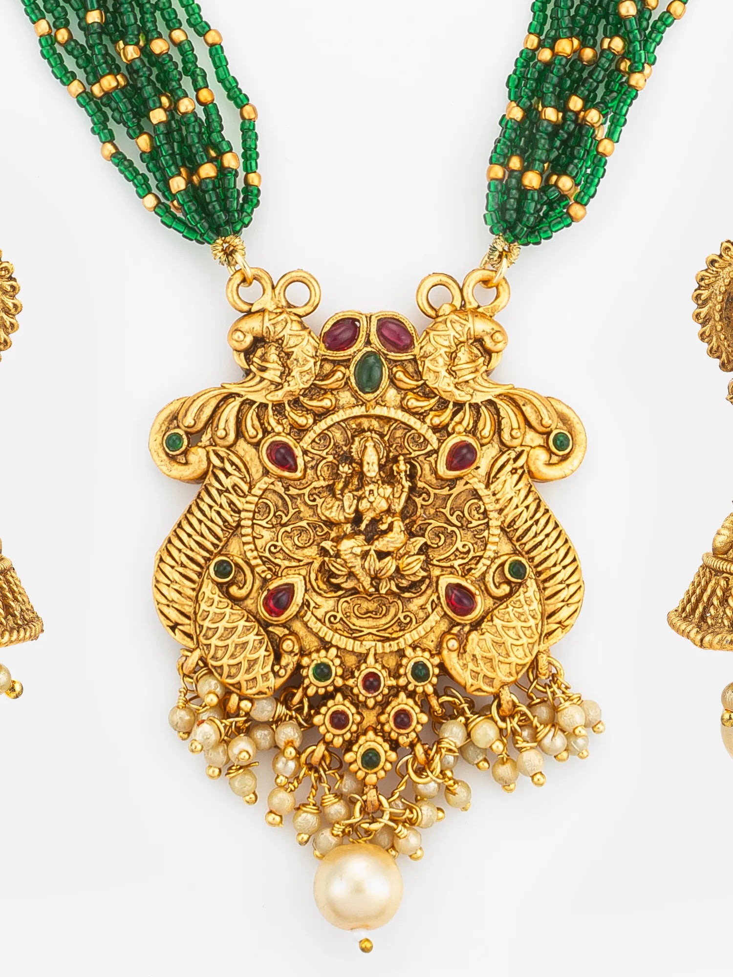 Gold necklace with green beaded chain and decorative pendant on a white background