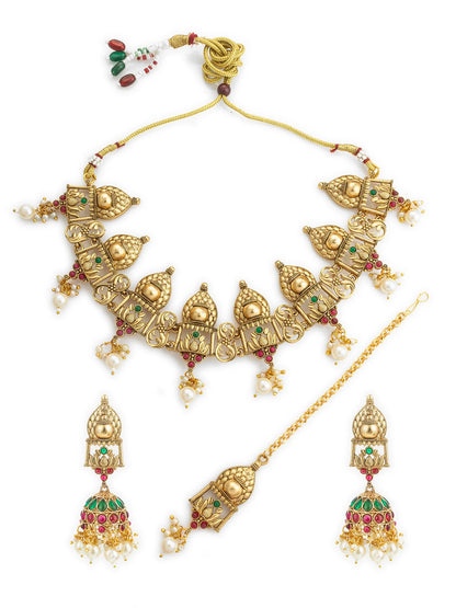 Gold jewelry set with necklace, earrings, and tikka on a white background
