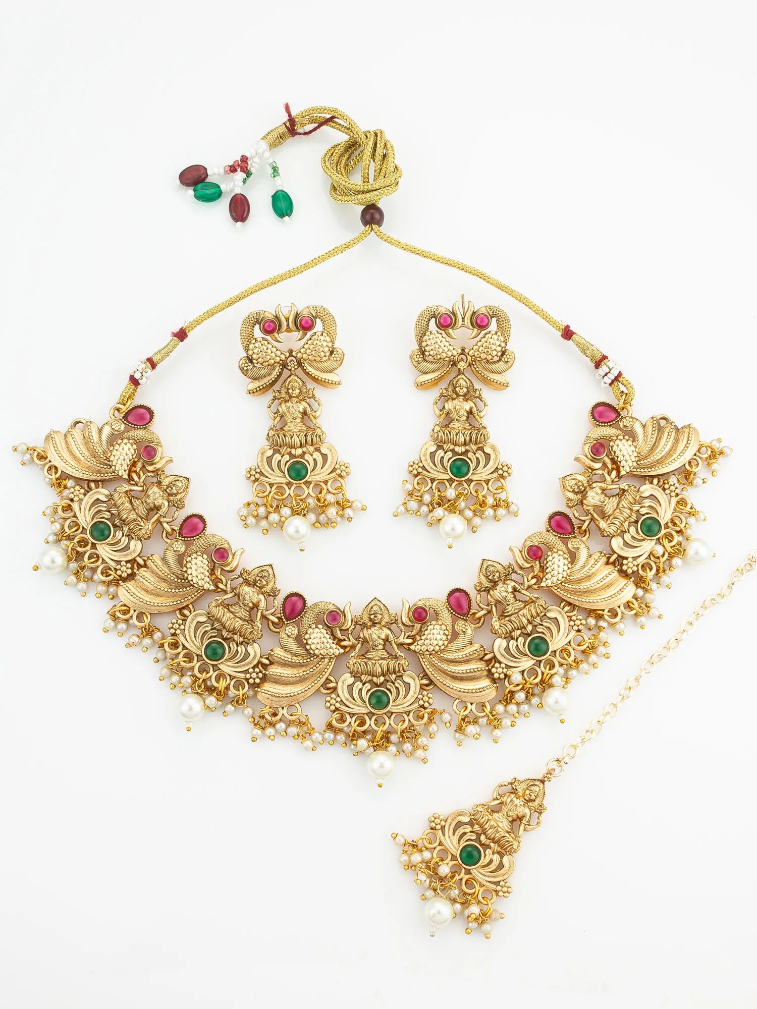 Gold necklace set with matching earrings on a white background
