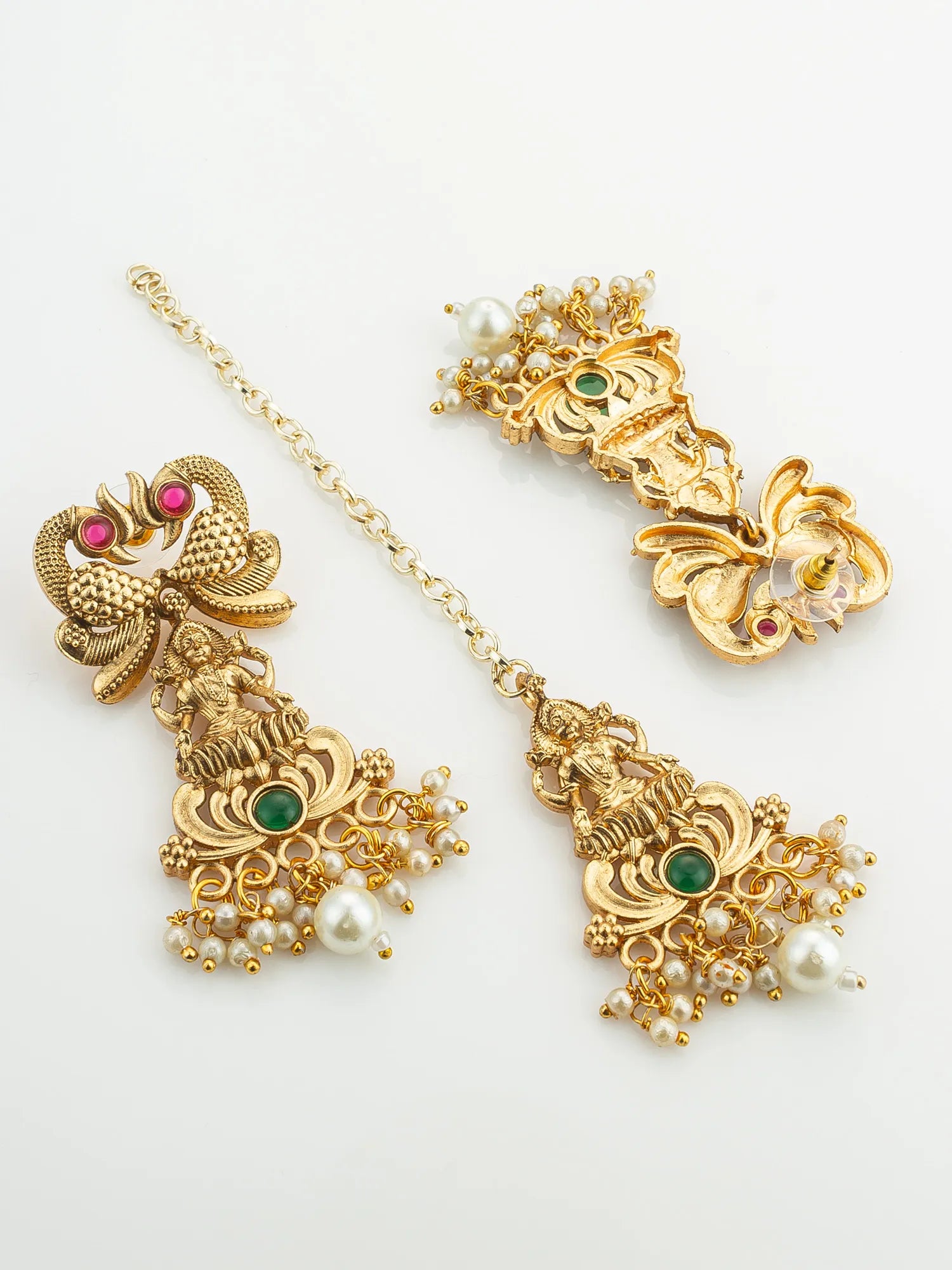 Gold jewelry set with earrings and a necklace on a white background