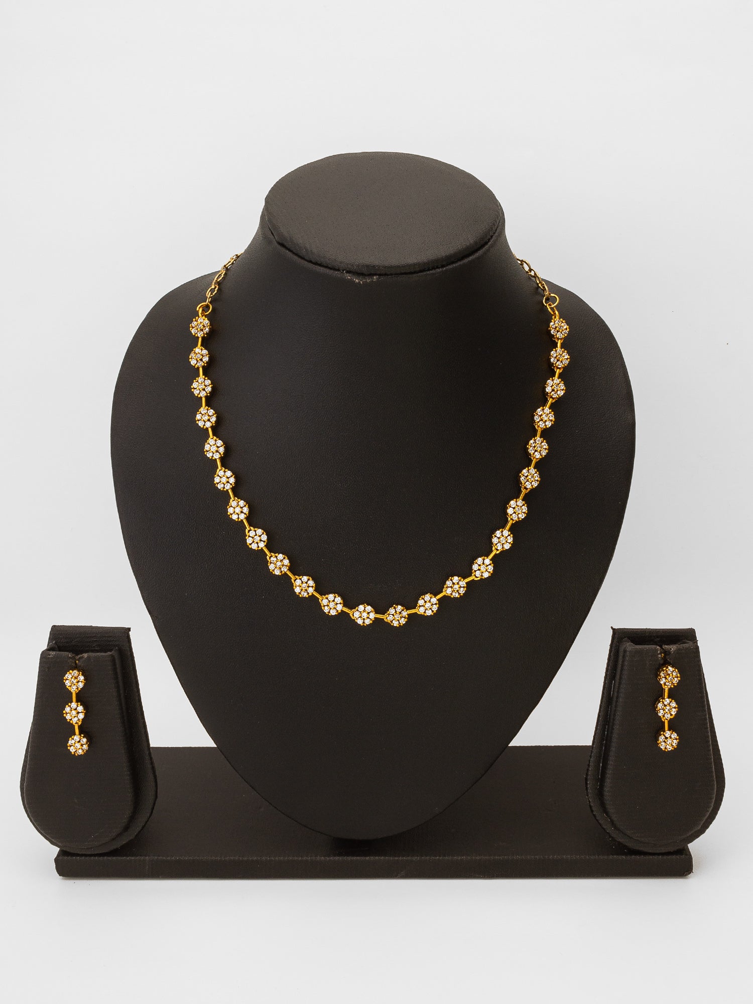 Aadita Gold-Plated AD Stone Floral Cluster Necklace Set with Linear Drop Earrings