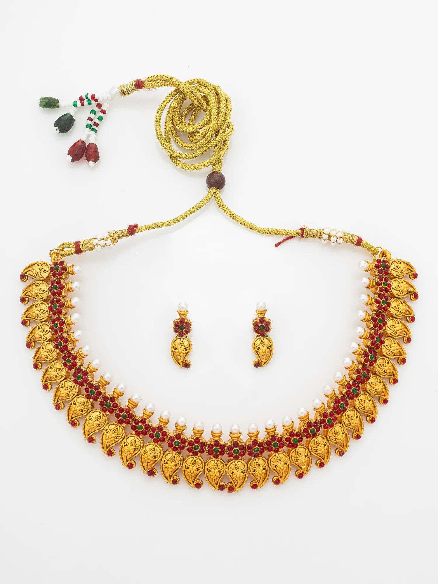 Gold-toned traditional necklace and matching drop earrings with red stone accents and small white pearl-like beads, displayed on a plain white background.