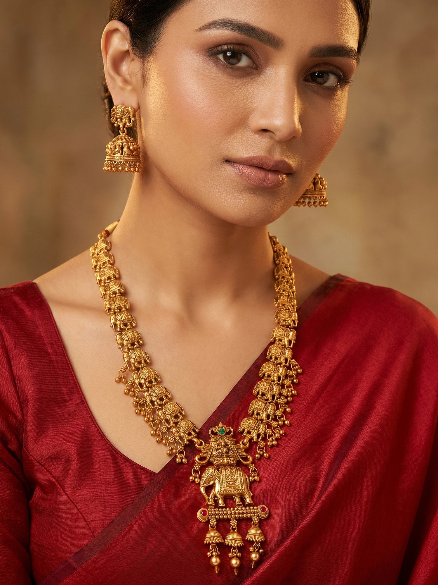 Aadita Gold-Plated Elephant Motif Long Necklace Set with  Stud Jhumka Earrings