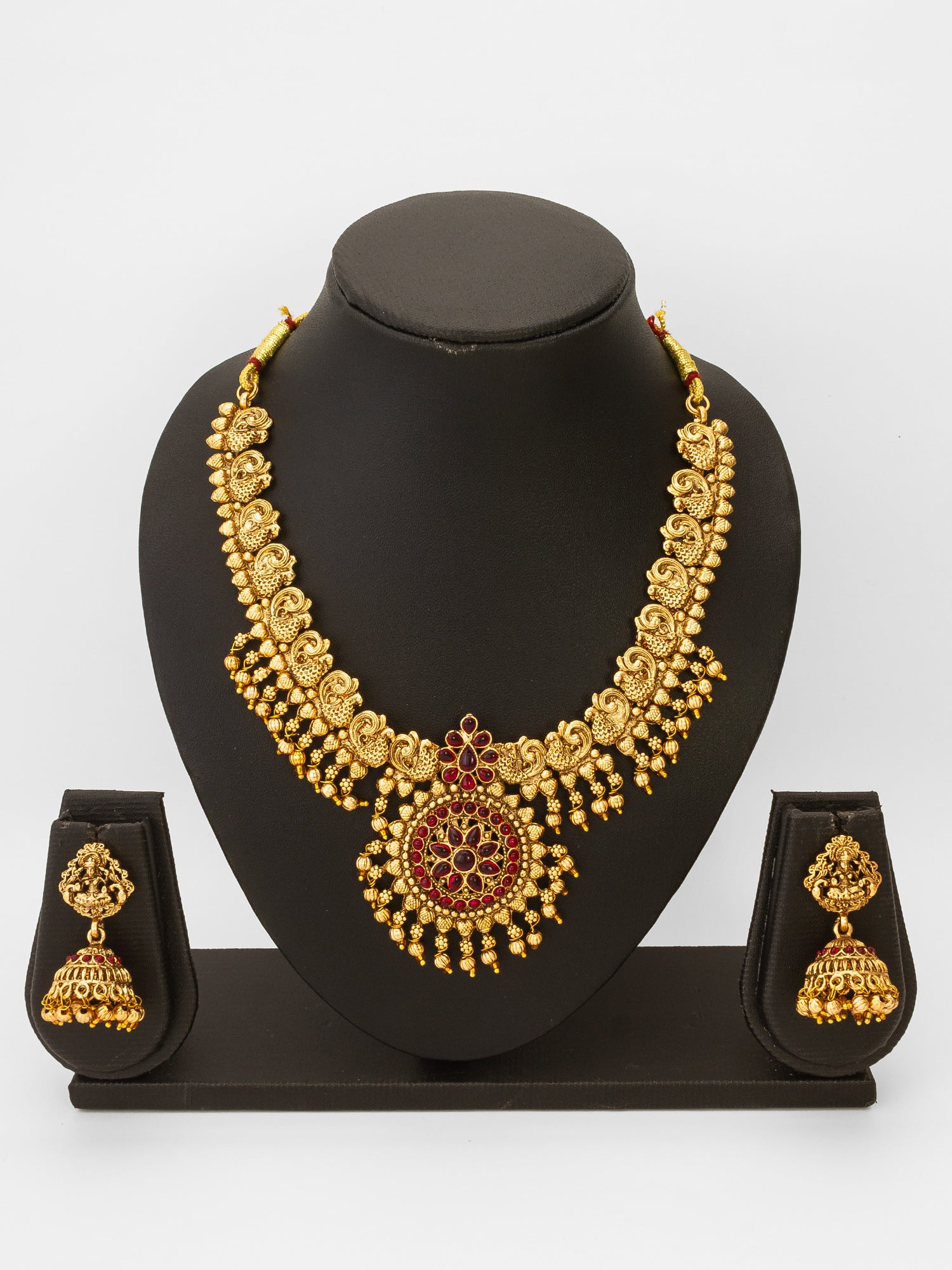 Aadita Antique Gold Temple Necklace Set with Stones and Jhumka Earrings