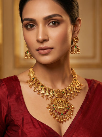 Aadita Antique Gold Temple Necklace Set with Lakshmi and Peacock Motifs, Stones and Jhumka Earrings