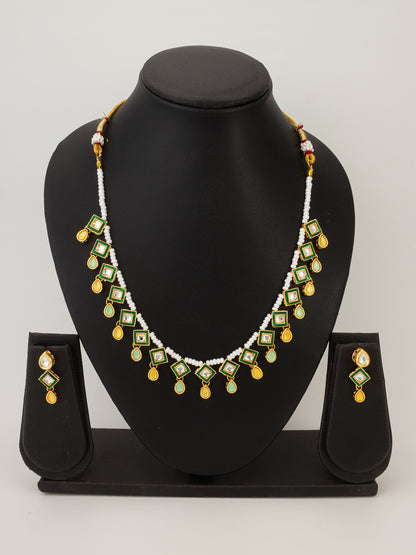 Aadita Pearl Necklace with Green Square Kundan and Yellow Drops