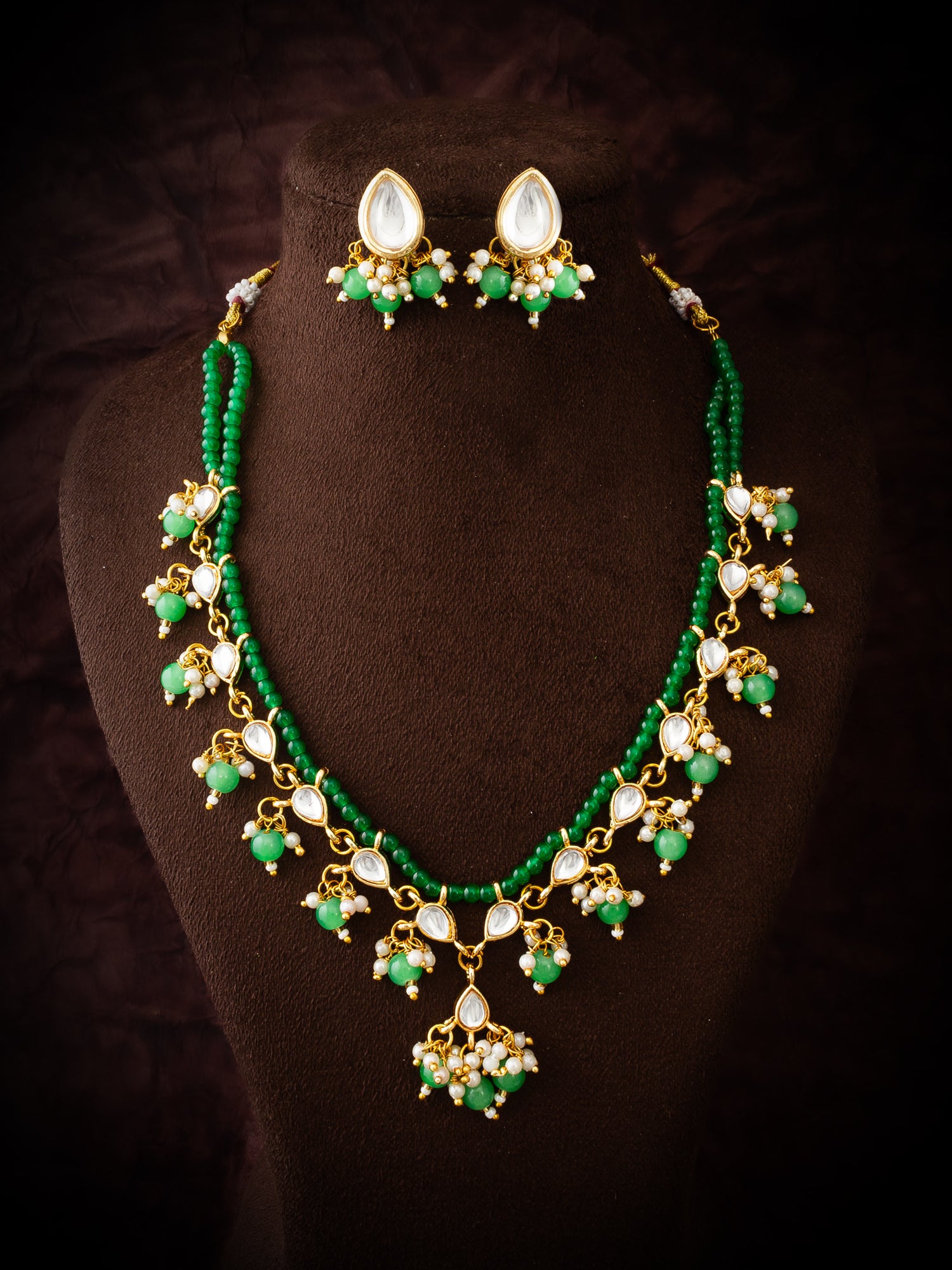 Aadita Gold-Plated Kundan Necklace Set with Green Beads and Stud Earrings